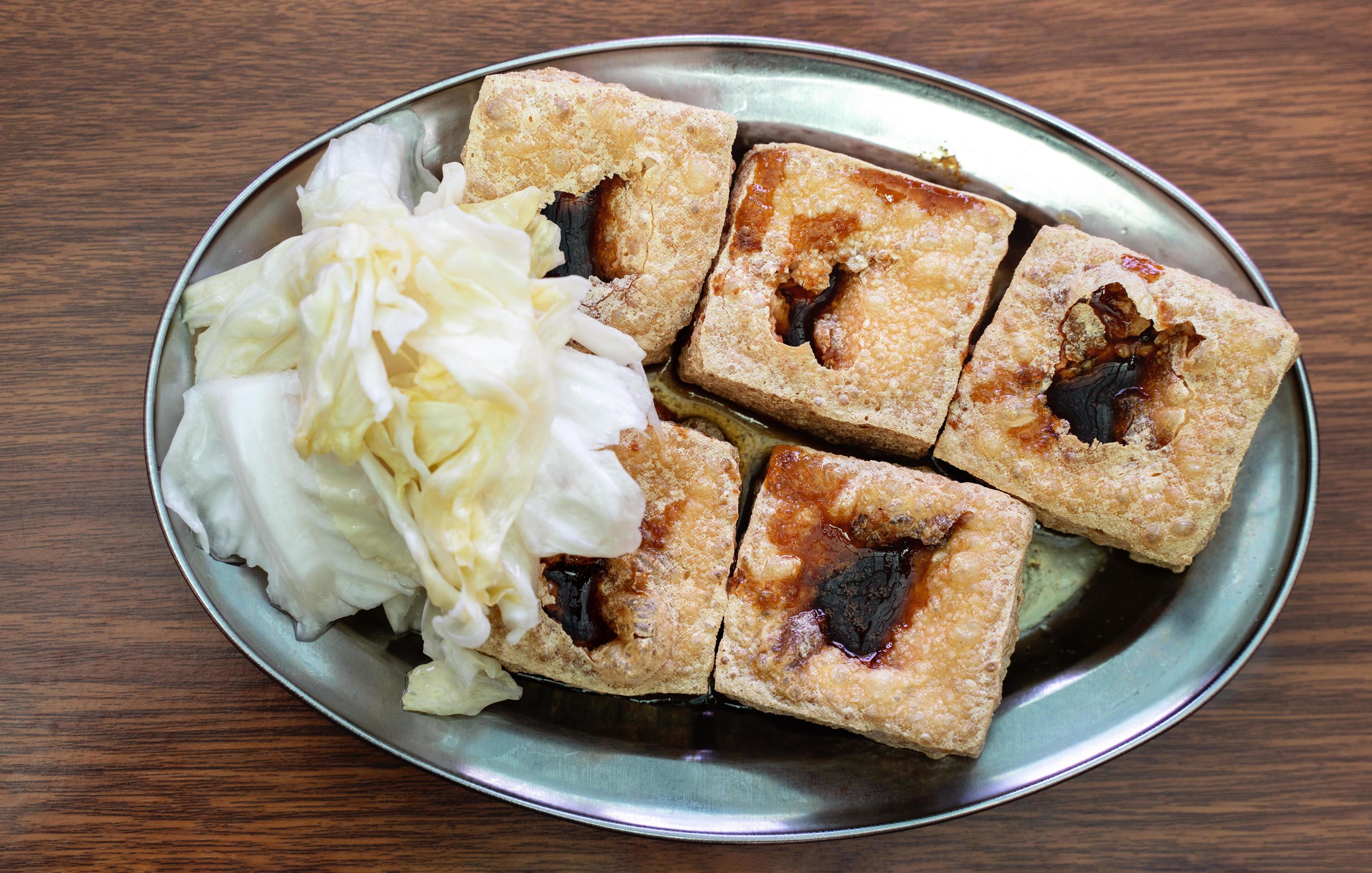 Deep fried stinky tofu with pickled cabbage, famous and delicious street food in Taiwan. Stock Free