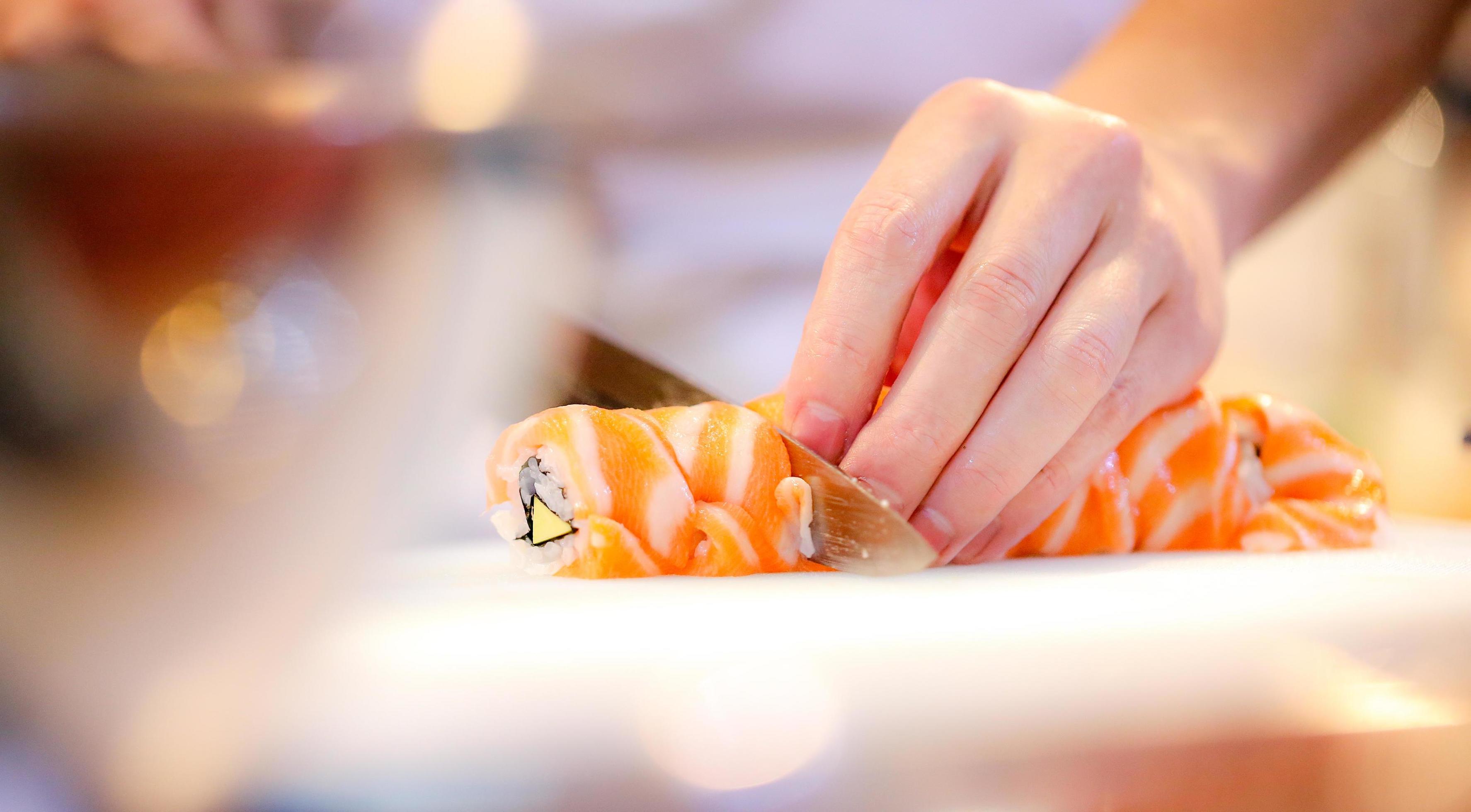 chef hands preparing japanese food, chef making sushi Stock Free