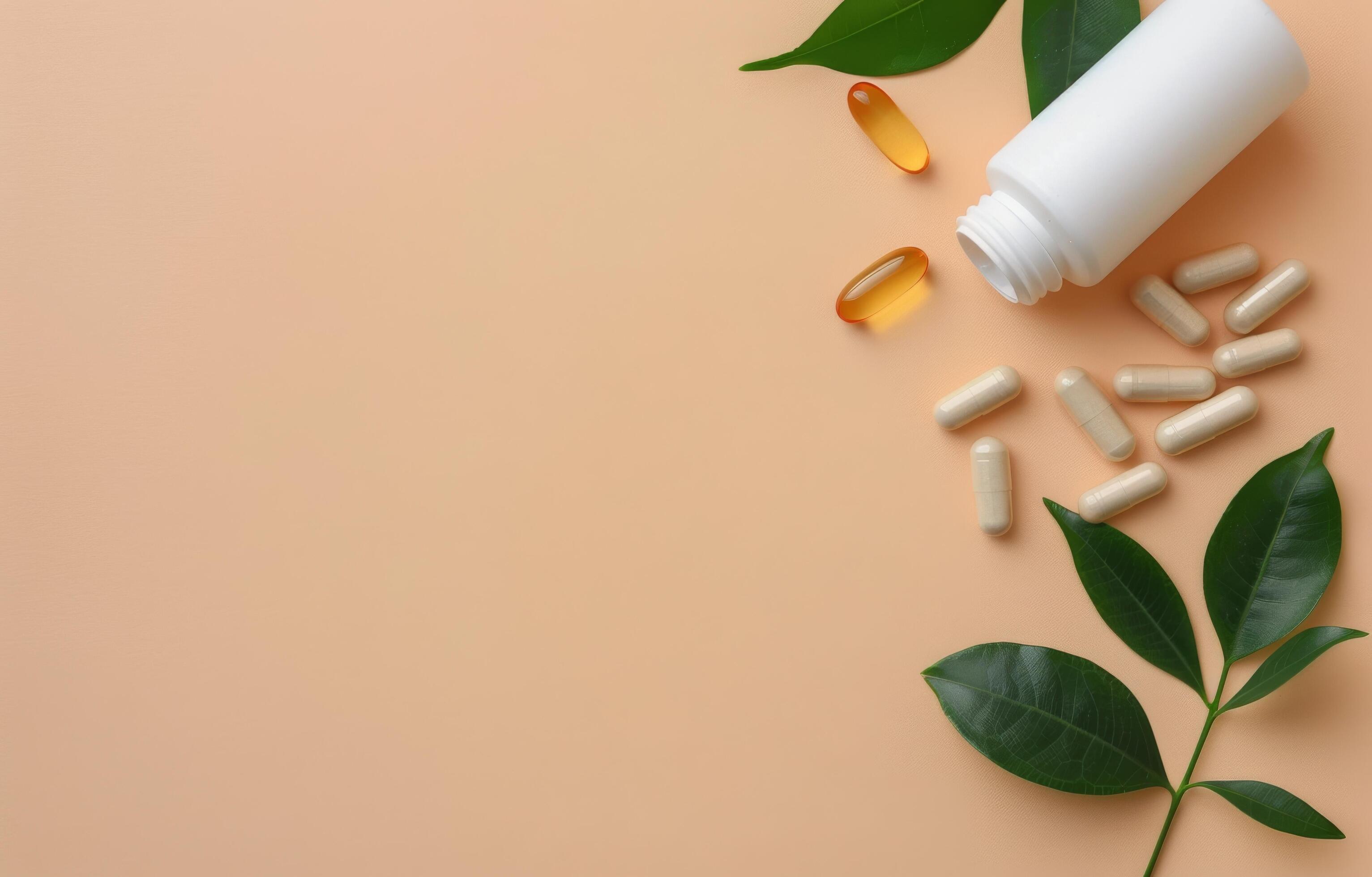 Pills and Leaves on a Peach Background Stock Free