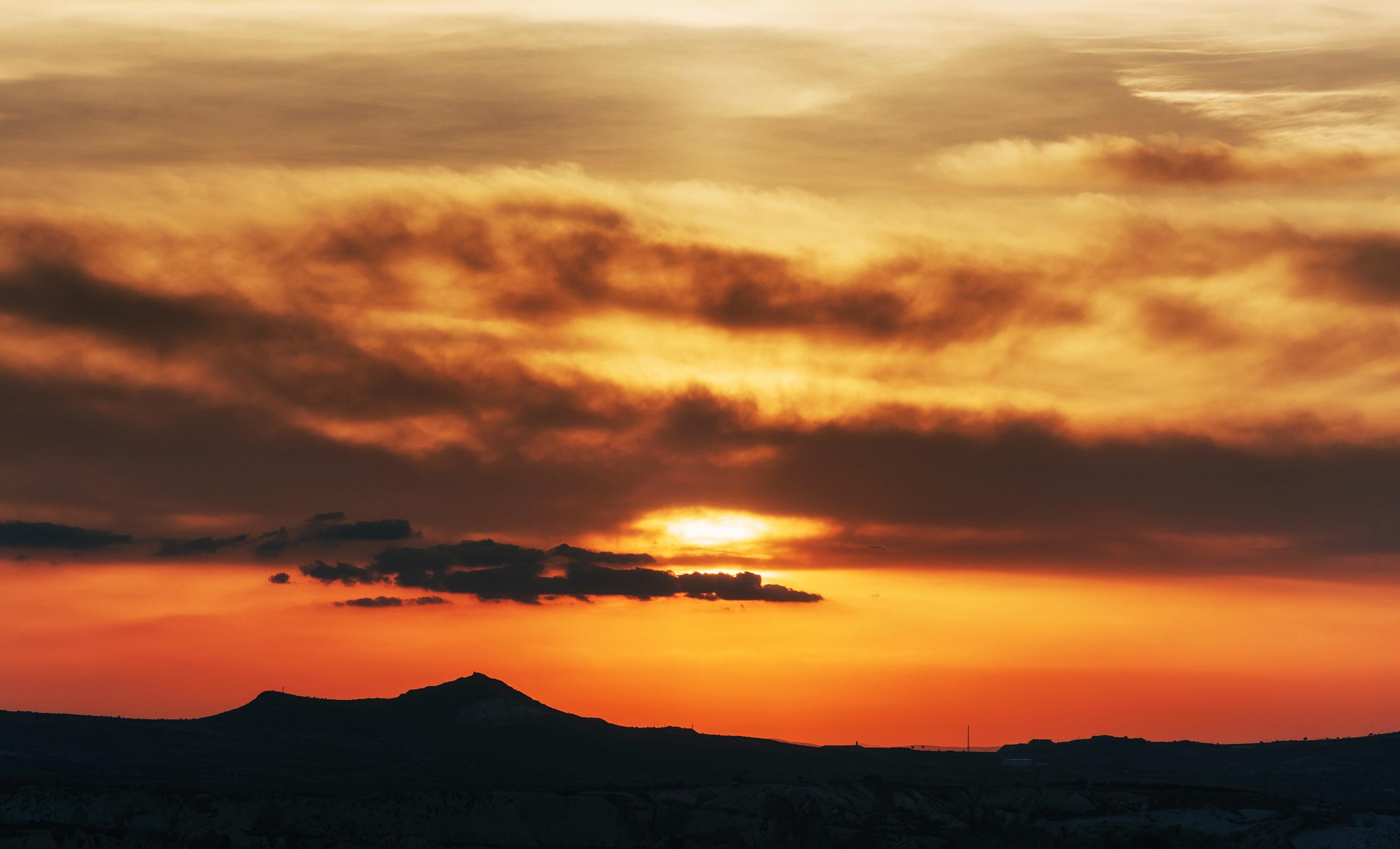 colorful sky with sun background in mountains. sunset, sunrise. Stock Free