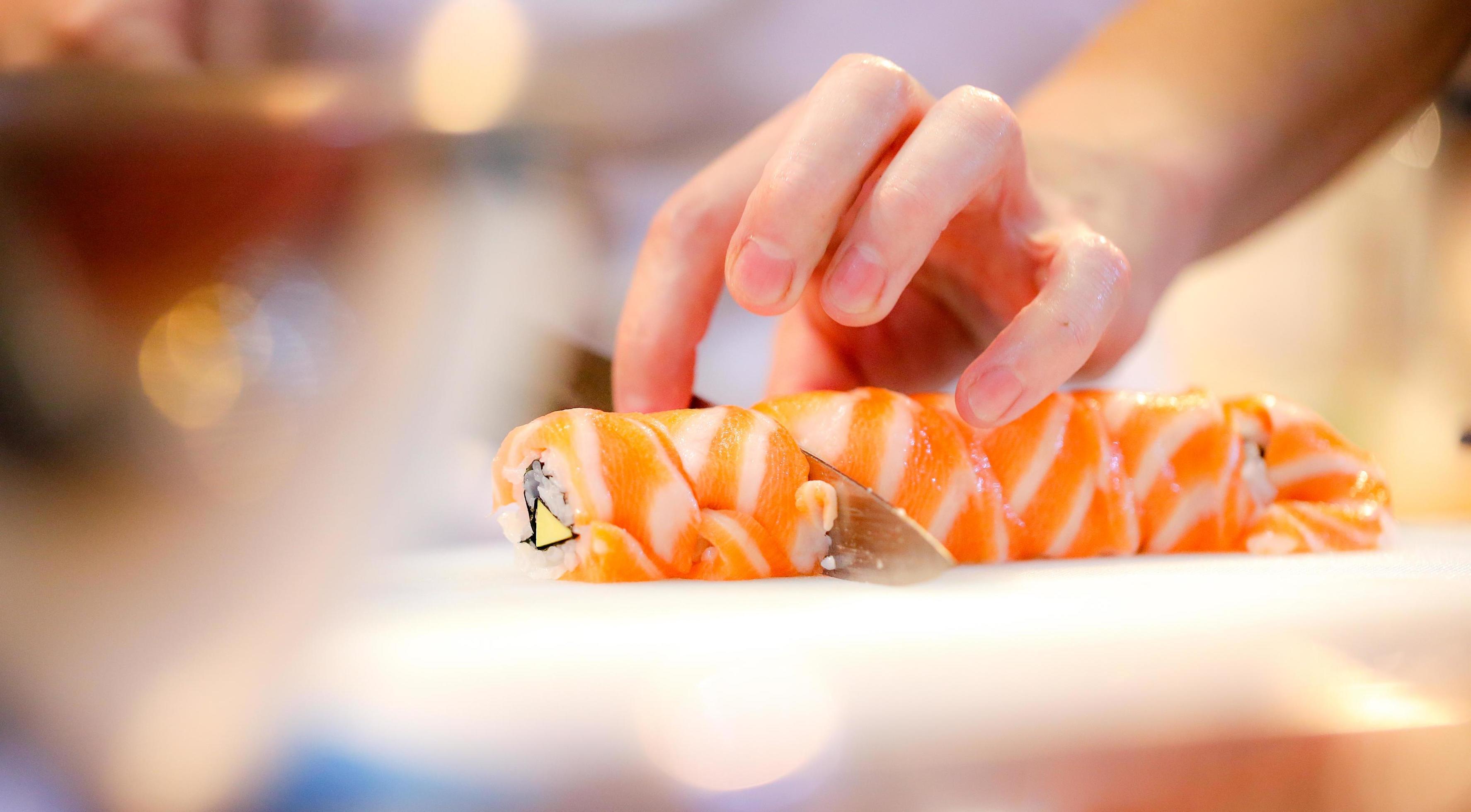 chef hands preparing japanese food, chef making sushi Stock Free