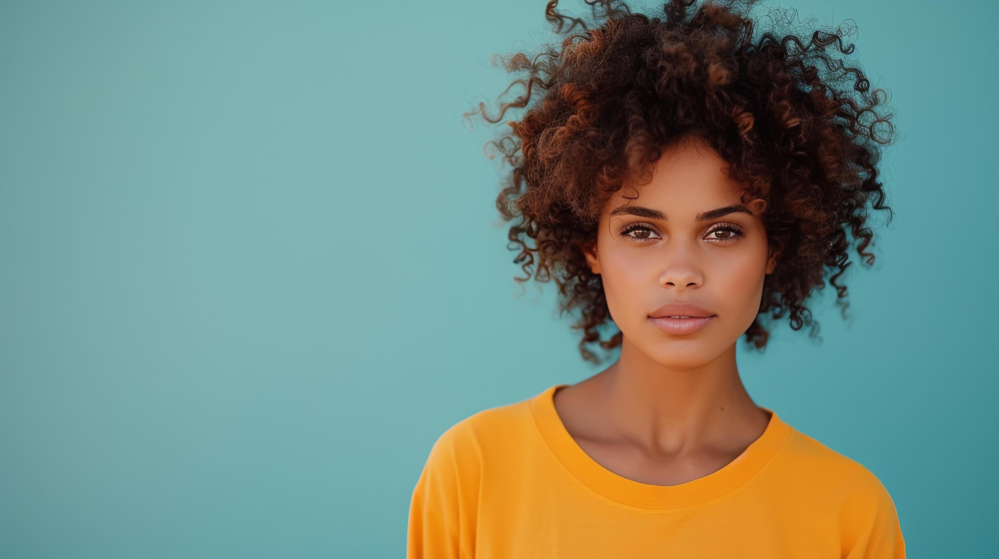 Smiling Young Girl With Natural Hair Posing Against Colorful Background in Bright Room Stock Free