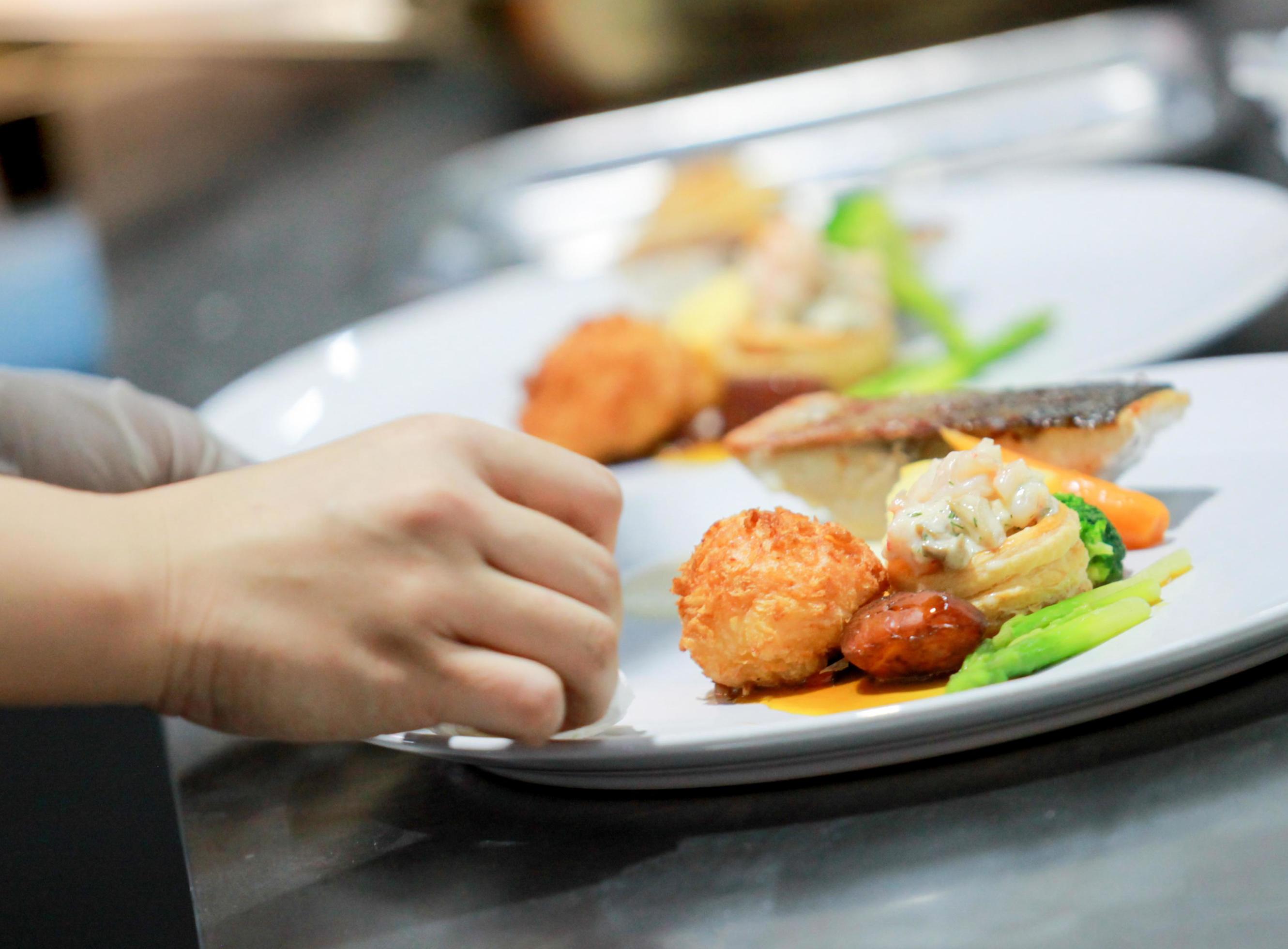 Chef preparing food in the kitchen, chef cooking, Chef decorating dish Stock Free