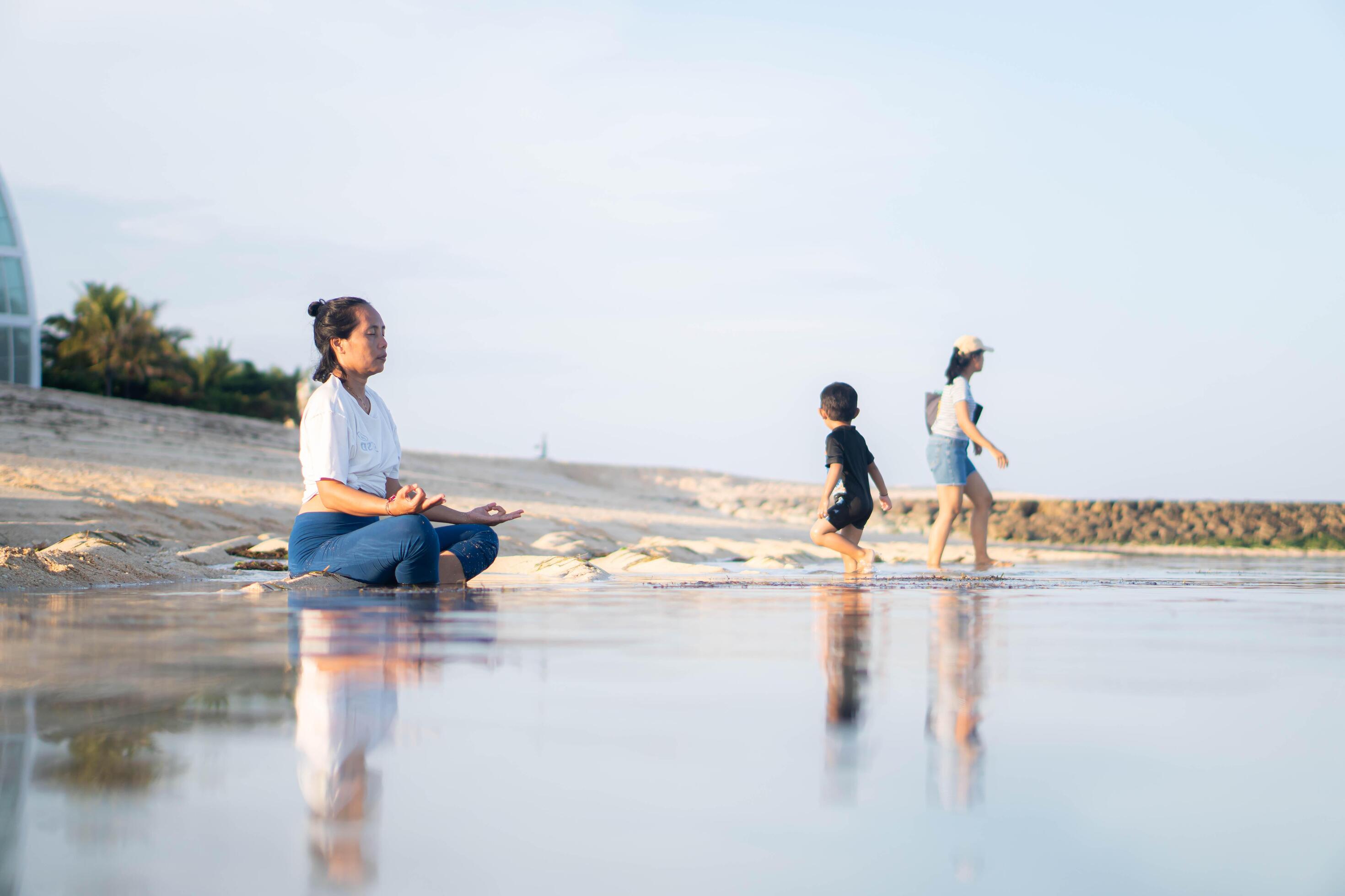 healthy woman with beautiful body doing yoga at sunrise on the beach, yoga poses Stock Free