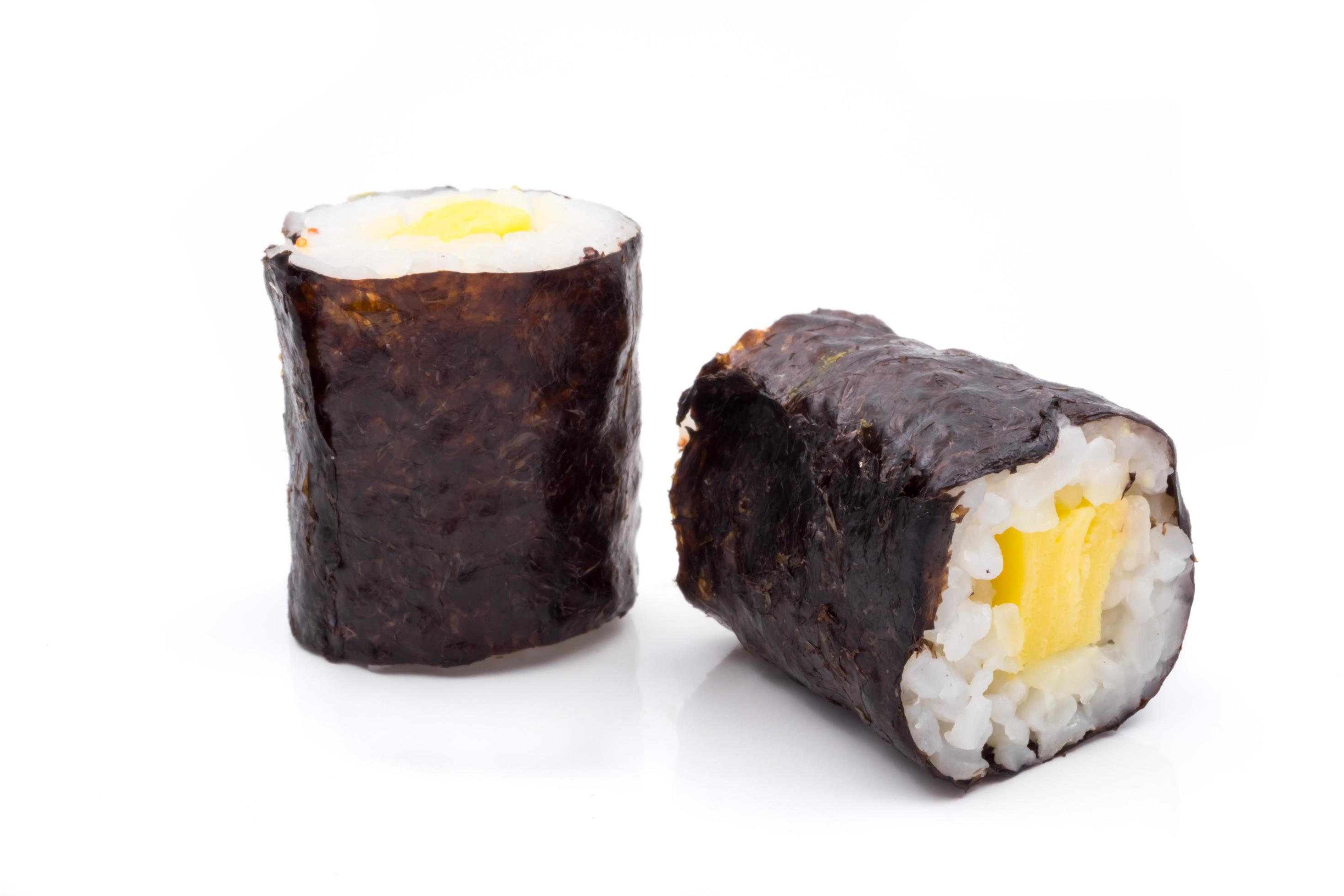 Sushi rolls, rice with egg and seaweed on white background, japanese food. Stock Free