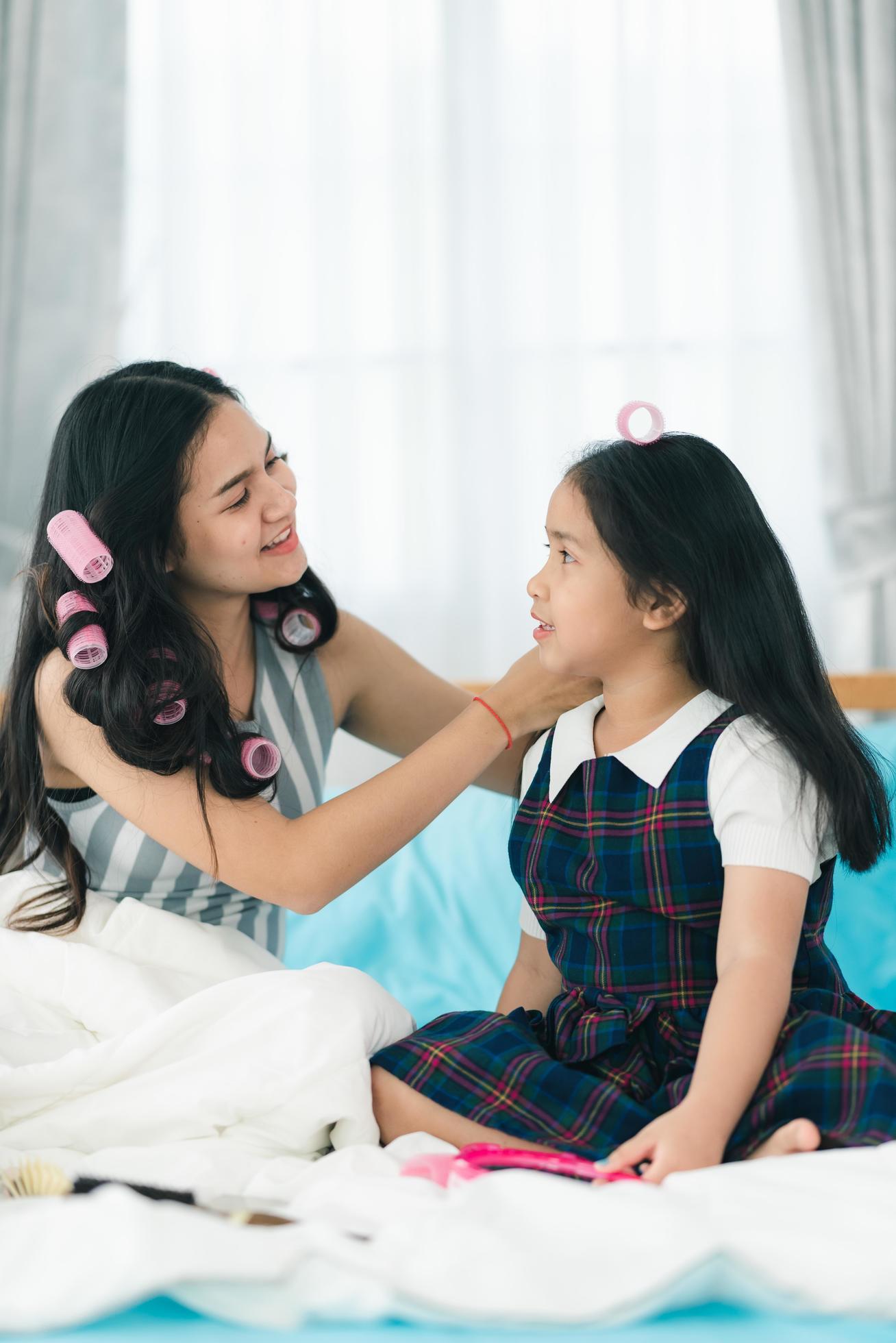 Asian woman Teenager in feeling of happy and smiling lifestyle while relax in living room at home Stock Free