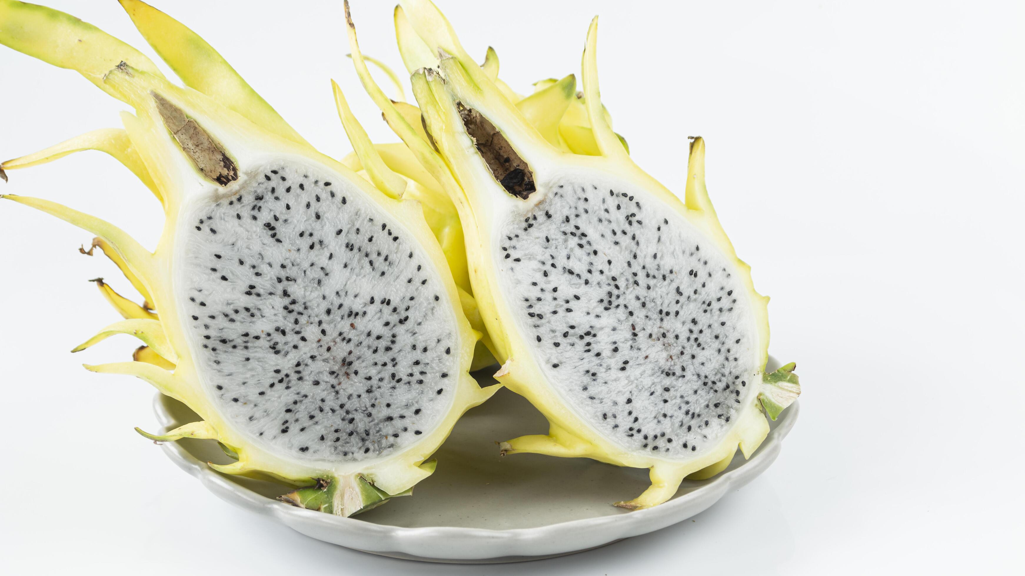 yellow dragon fruit on white background Stock Free