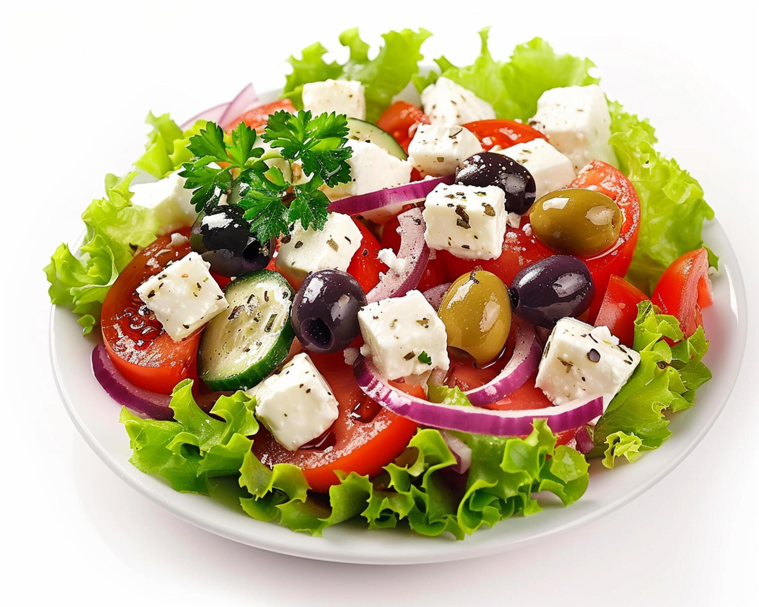 
									a plate of salad with tomatoes, cucumbers, onions and feta cheese Stock Free