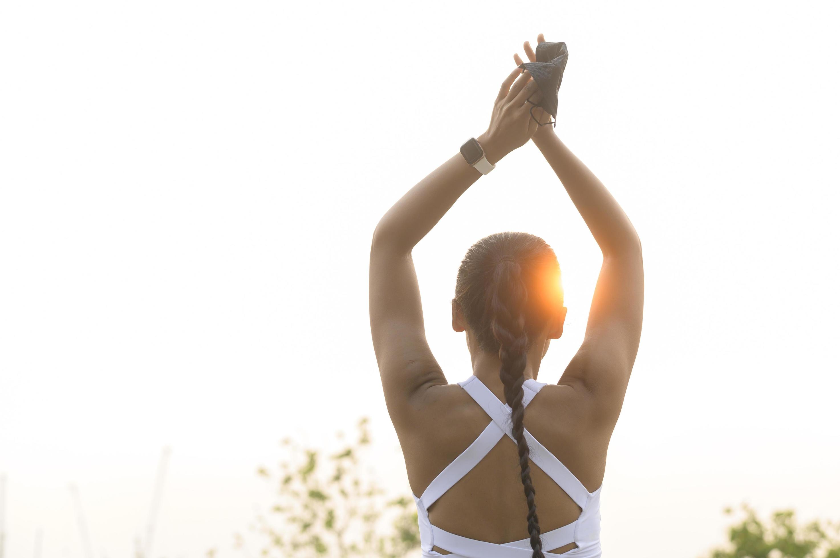 Young fitness woman in sportswear taking face mask off while exercise in city park, Health and Lifestyles. Stock Free