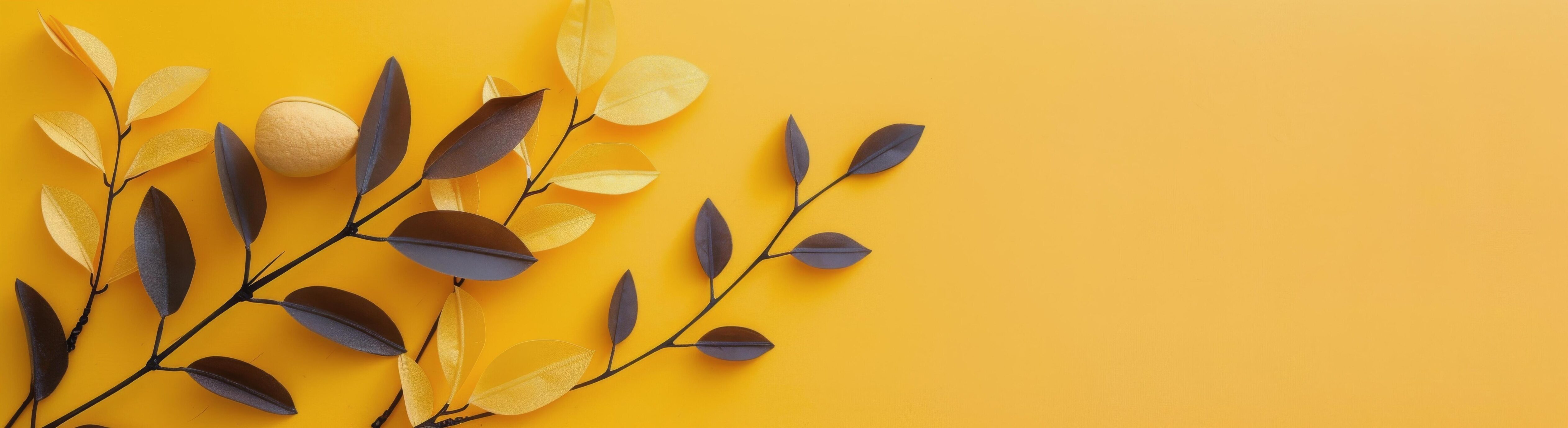 Decorative Brown Leaves Arranged on Yellow Background in Autumn Style Stock Free