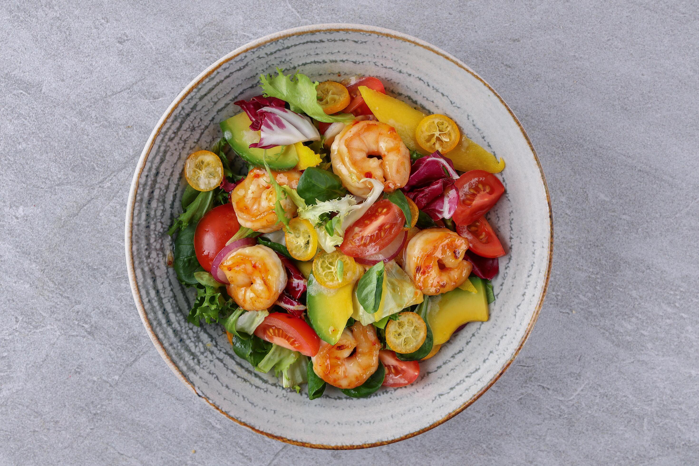 bowl with avocado shrimp and kumquat on stone background, studio food photography 5 Stock Free