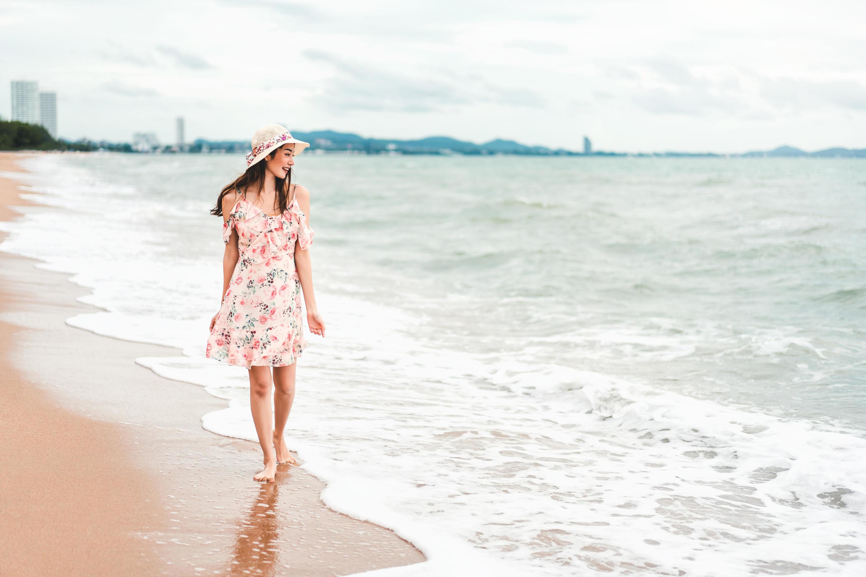 Young asian woman relax on the beach Stock Free