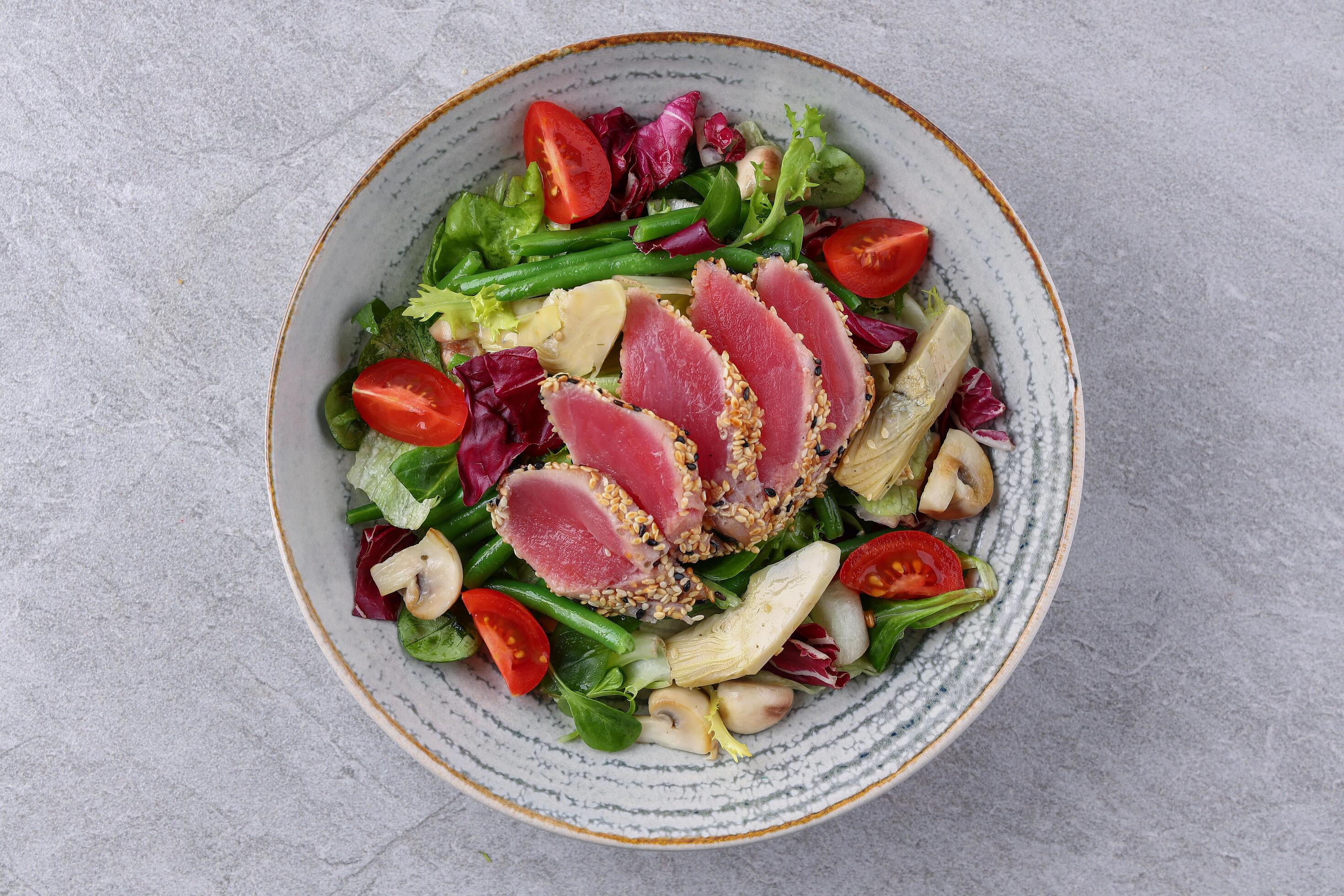 salad with carpaccio, artichoke and asparagus on a stone background, studio food photography 1 Stock Free