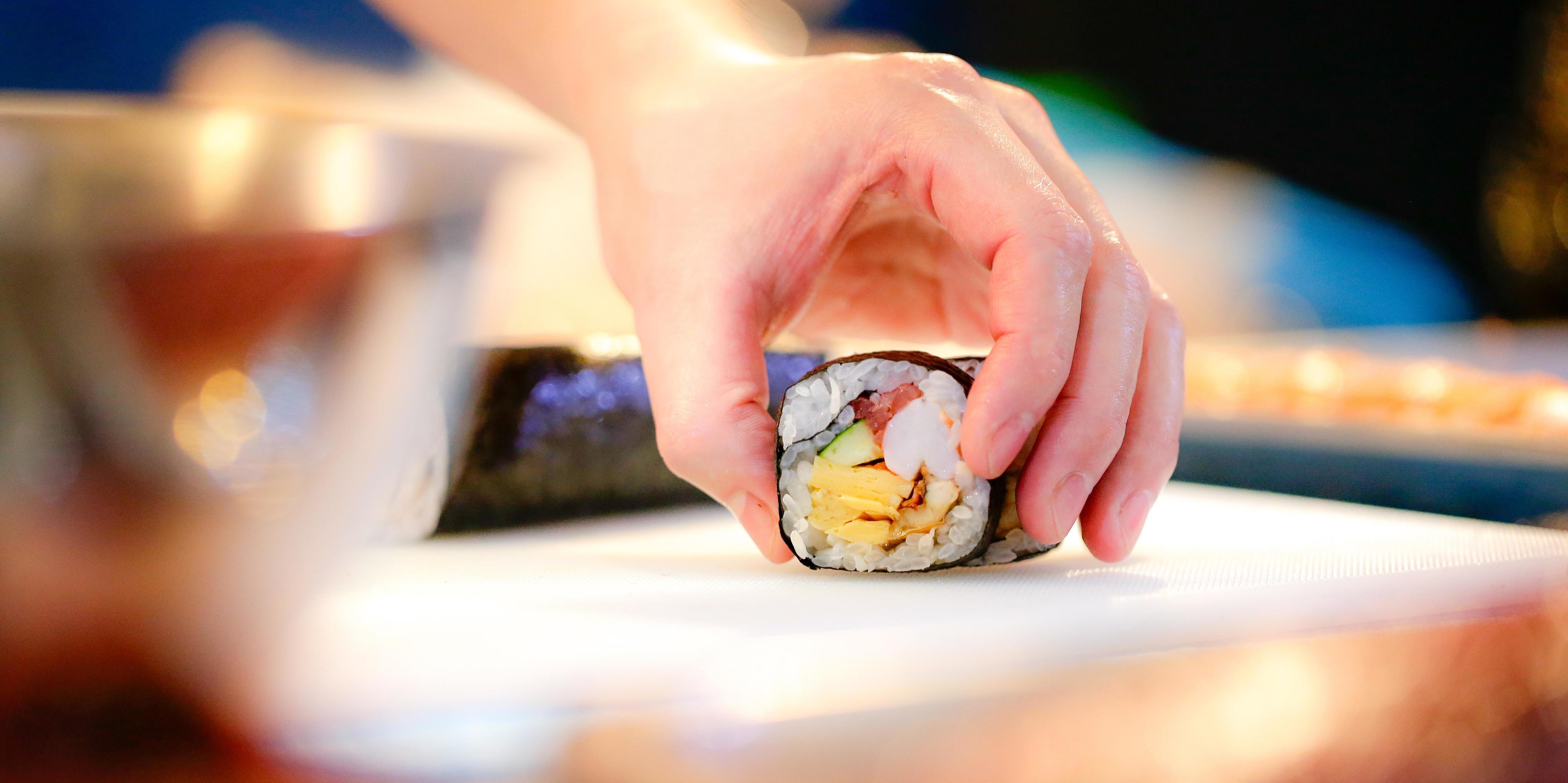 chef hands preparing japanese food, chef making sushi Stock Free