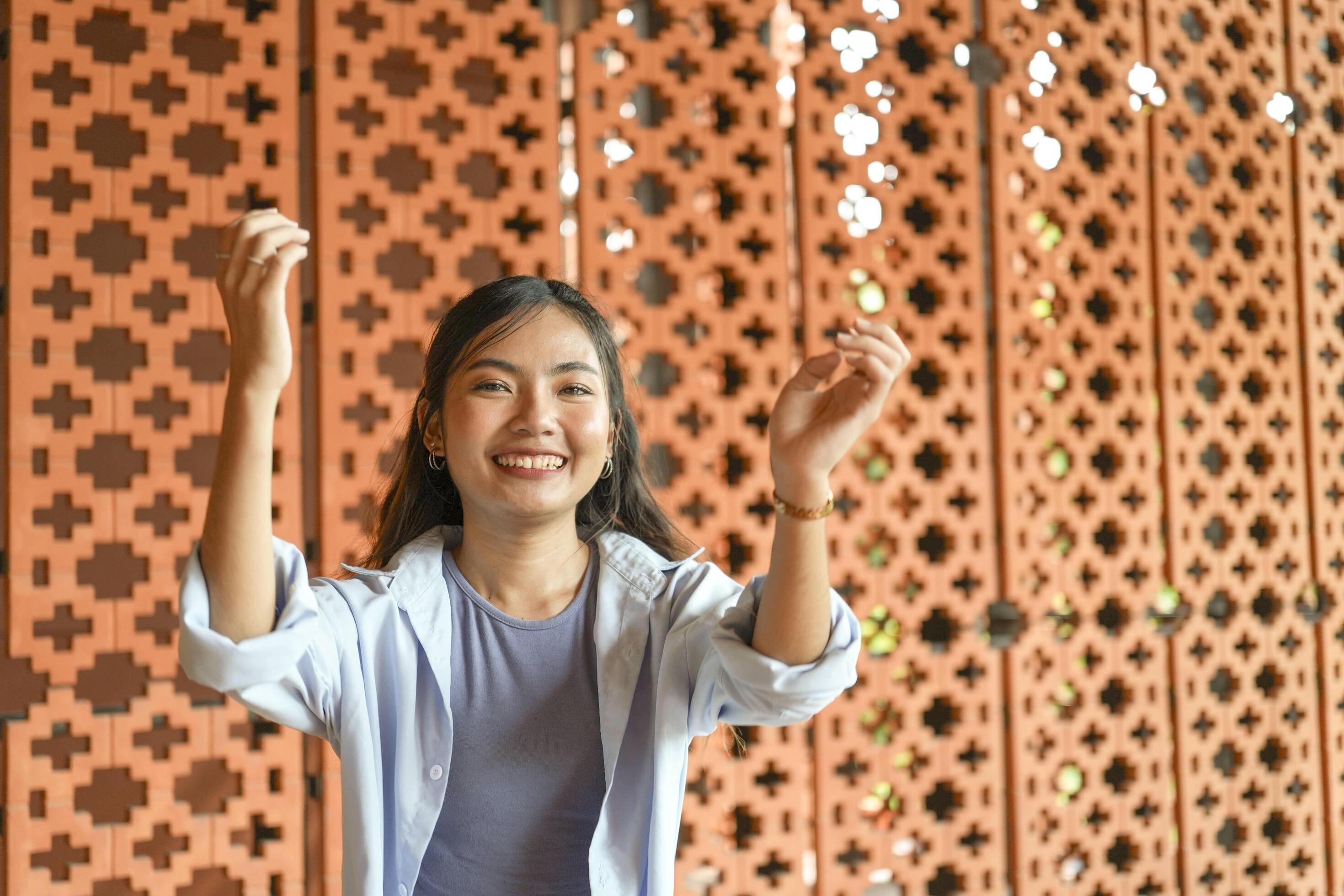 Asian women do freestyle hip hop and breakdancing in a public space in the middle of the city. With a cheerful and happy attitude Stock Free