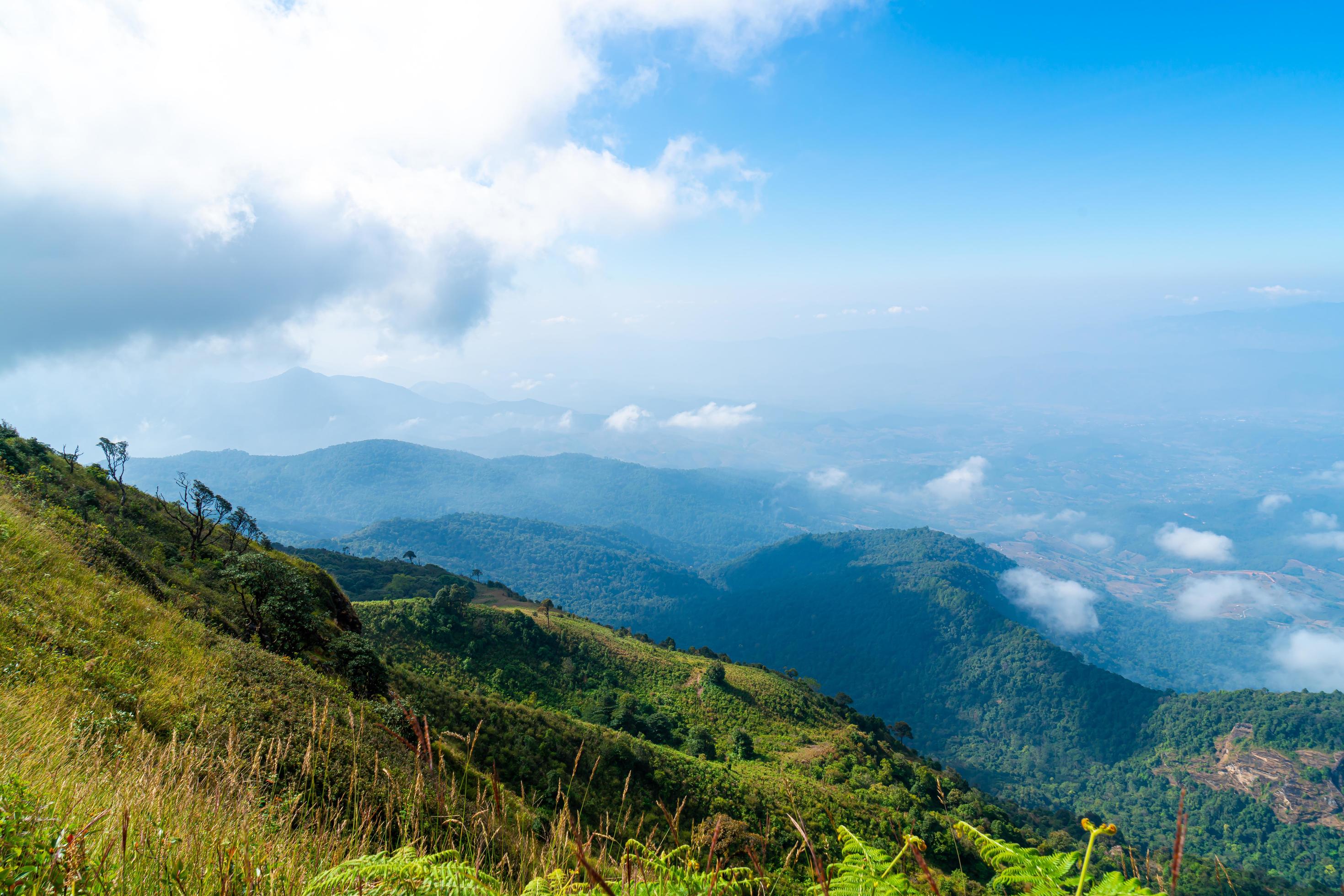 Beautiful mountain layer with clouds and blue sky at Kew Mae Pan Nature Trail in Chiang Mai, Thailand Stock Free