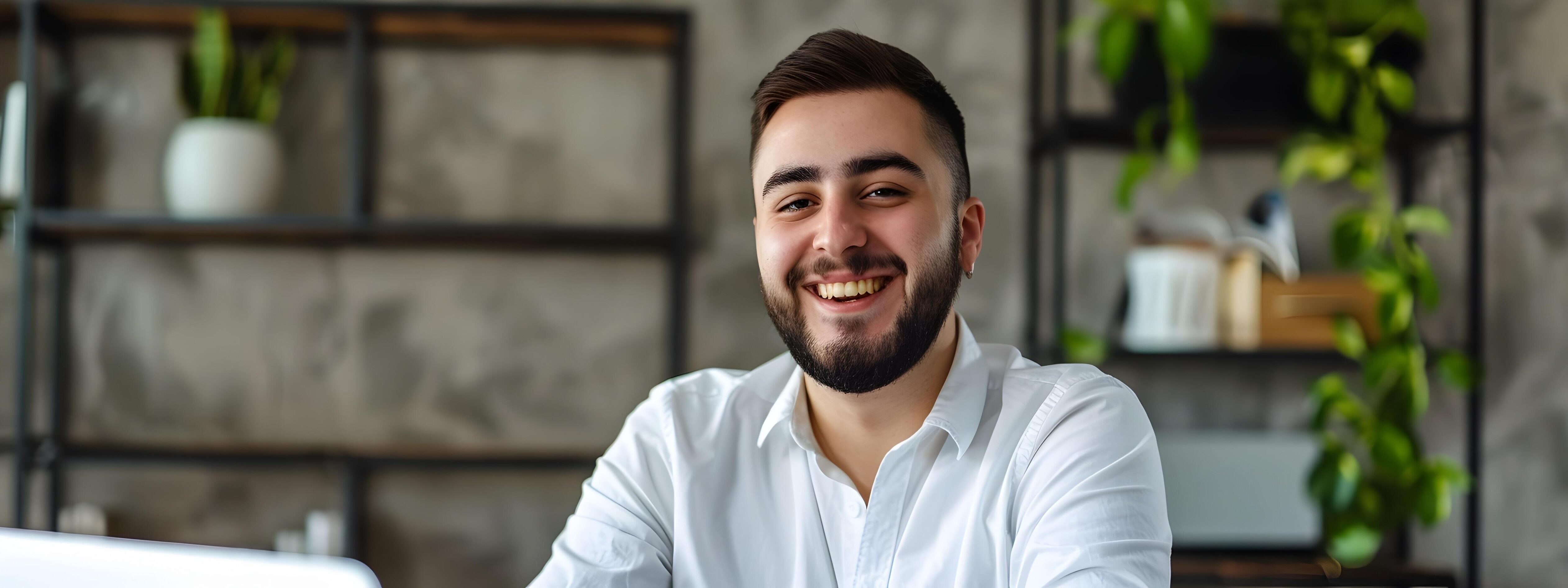 Cheerful Young Professional Businessman Enjoying Successful Work Day in Modern Office Stock Free