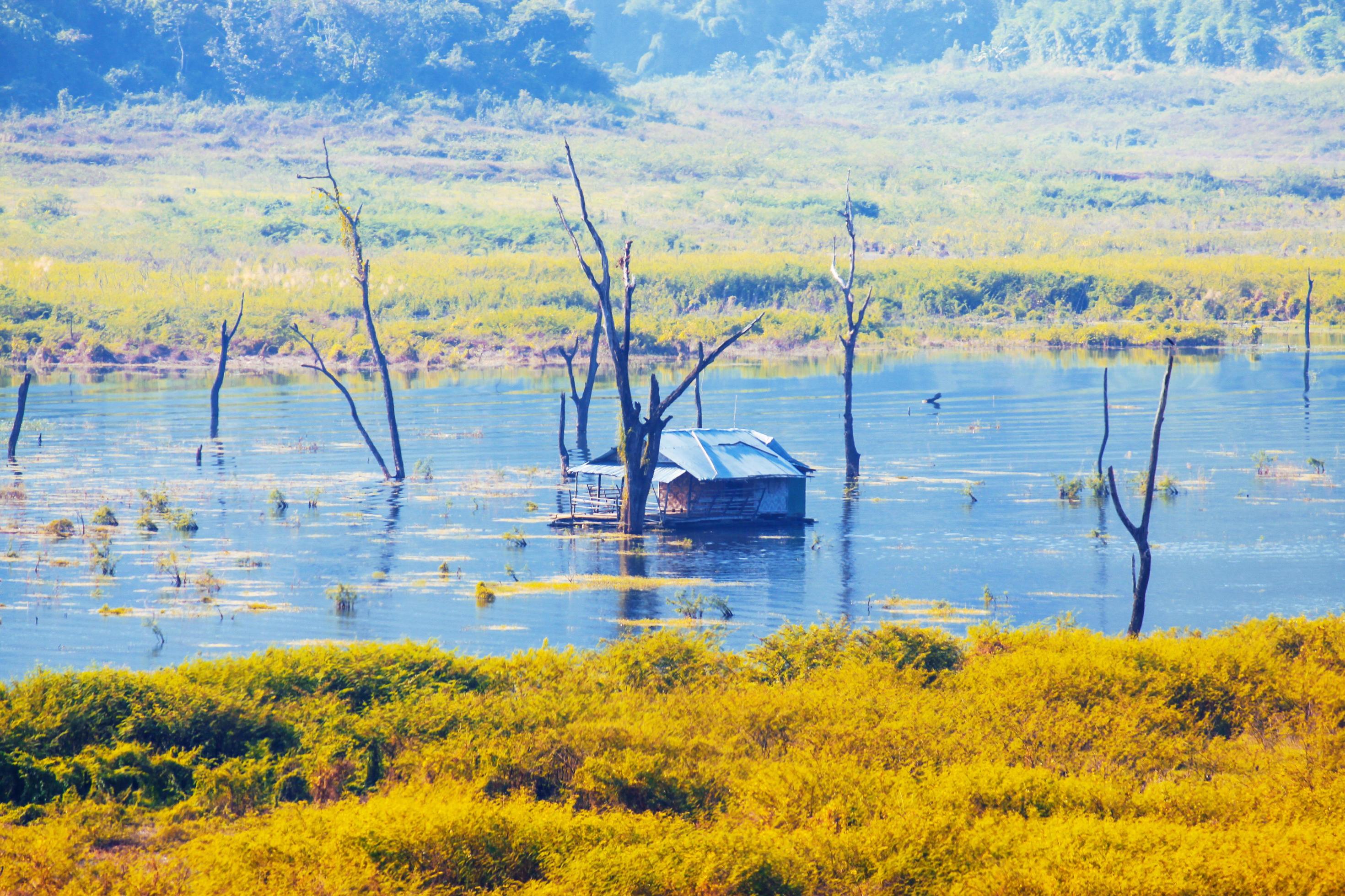 Houseboat in the Songgaria river and near mountain in Countryside of village at Snagklaburi, Thailand Stock Free