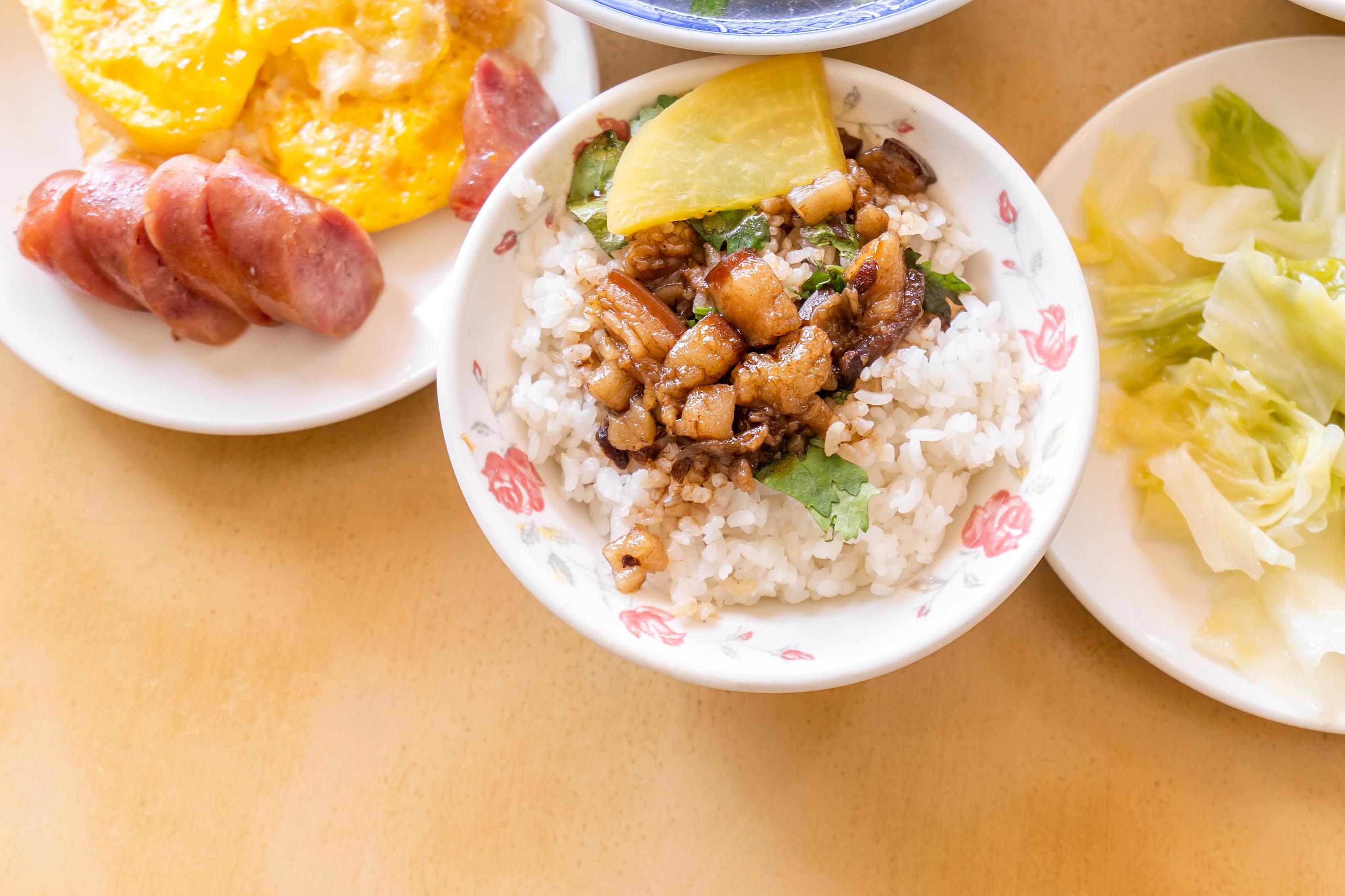 Braised pork over rice – Taiwan famous traditional street food delicacy. Soy-stewed pork on rice. Travel design concept. Top view,copy space,close up Stock Free