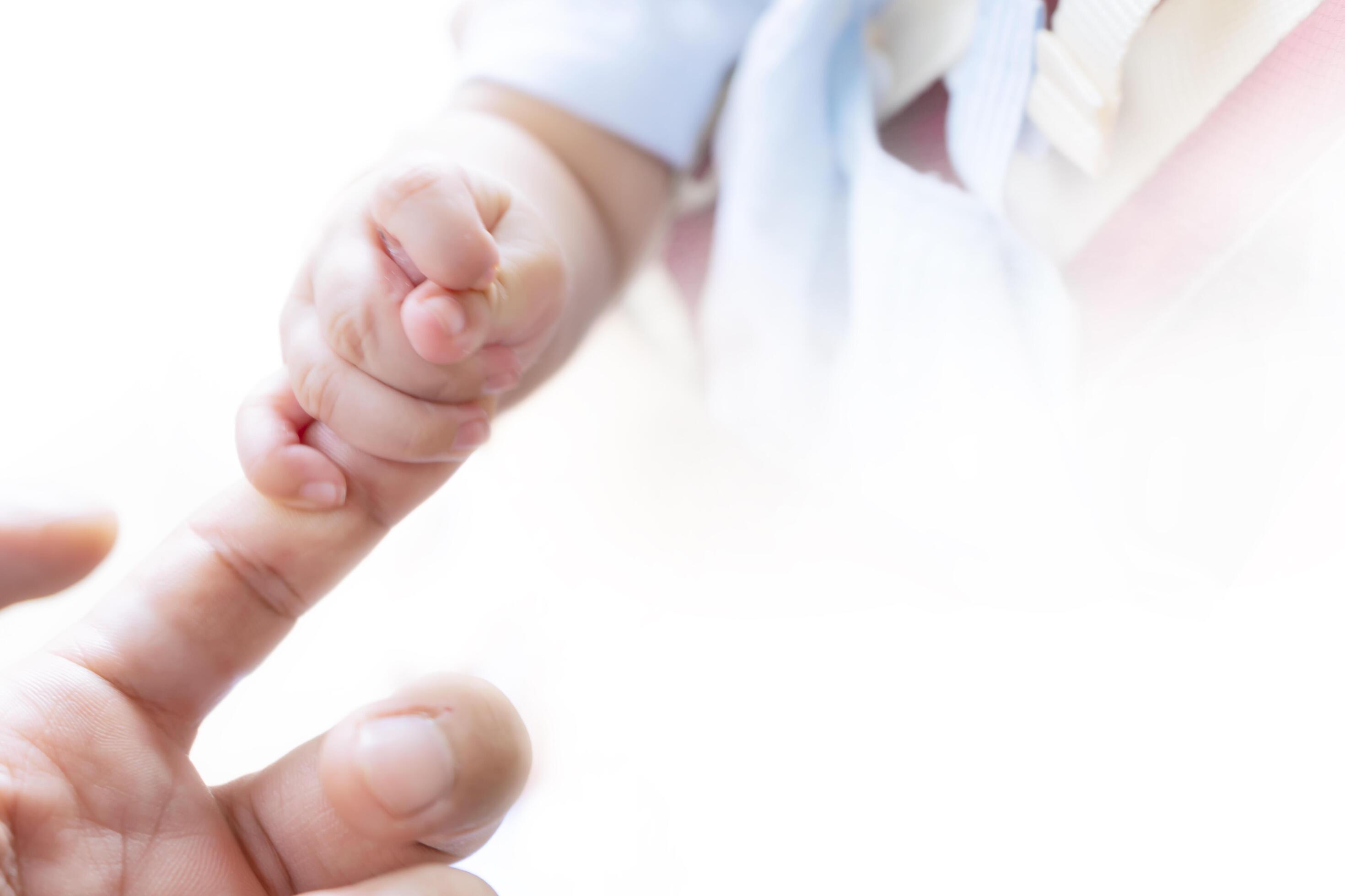 concept of love and family. hands of mother and baby closeup Stock Free