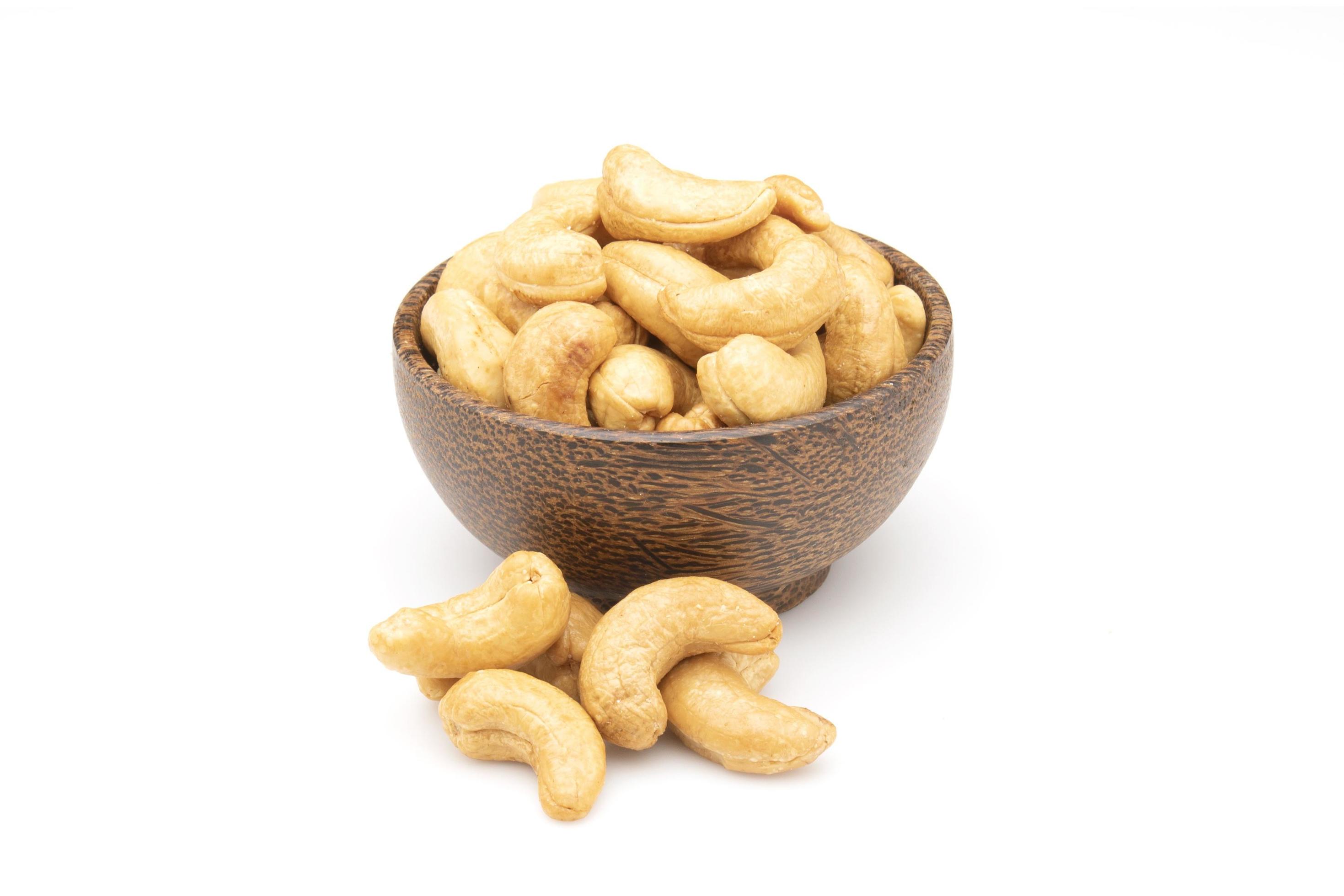 Pile of roasted cashew nut isolated on white background. Food concept Stock Free