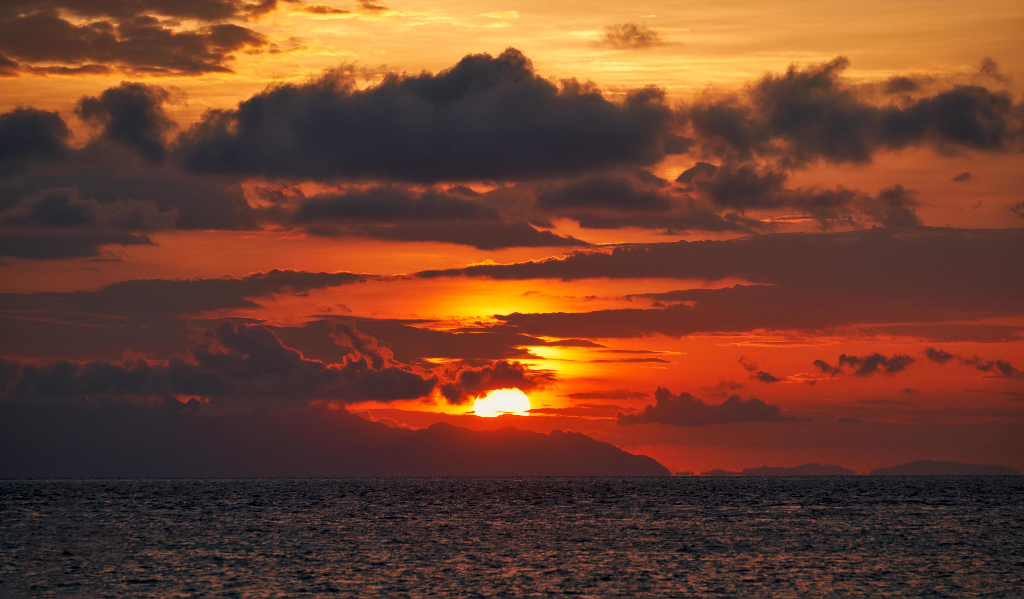 Seascape with colorful cloudy sunrise Stock Free