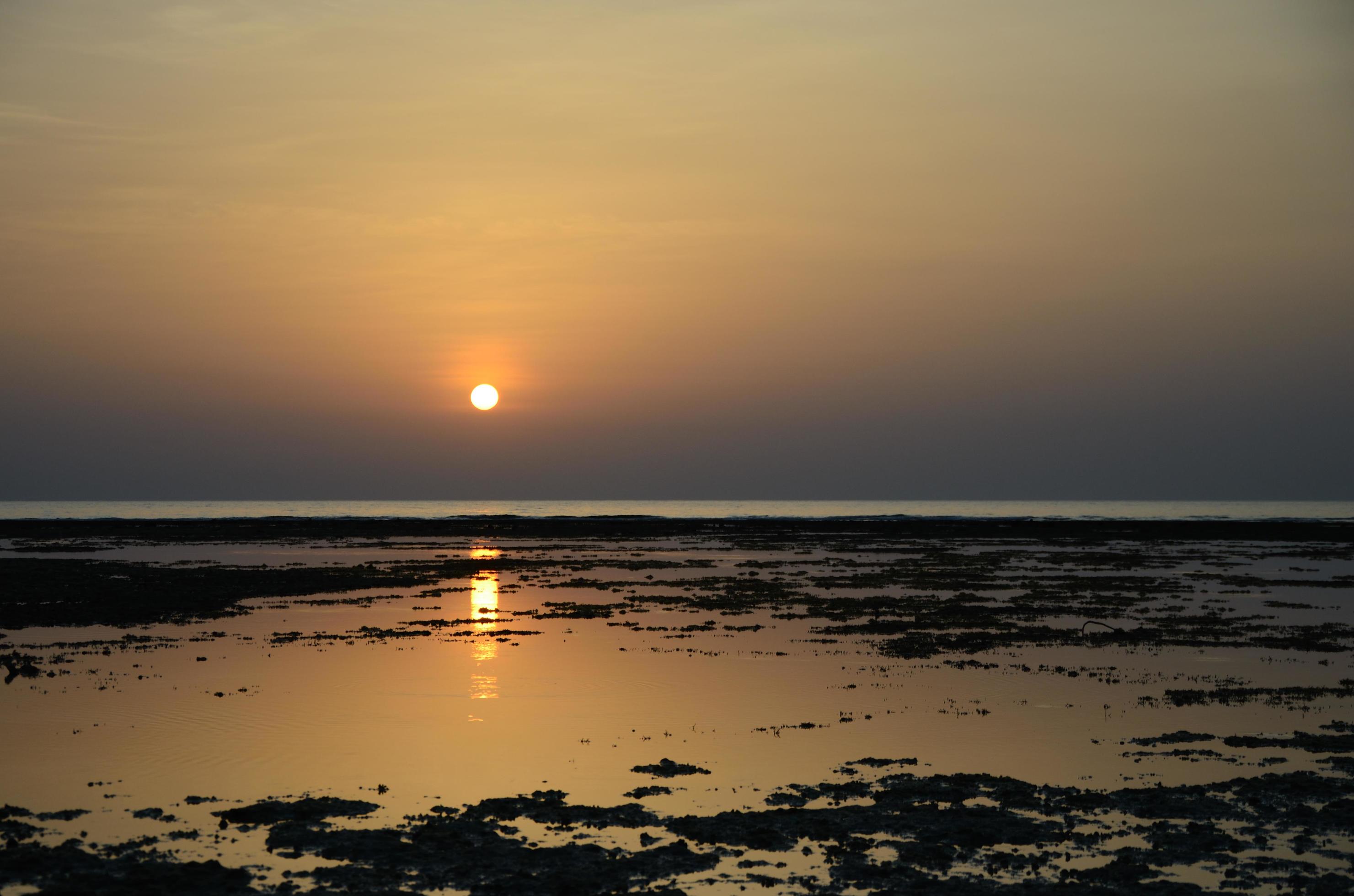 sunrise on sea with reflection Stock Free