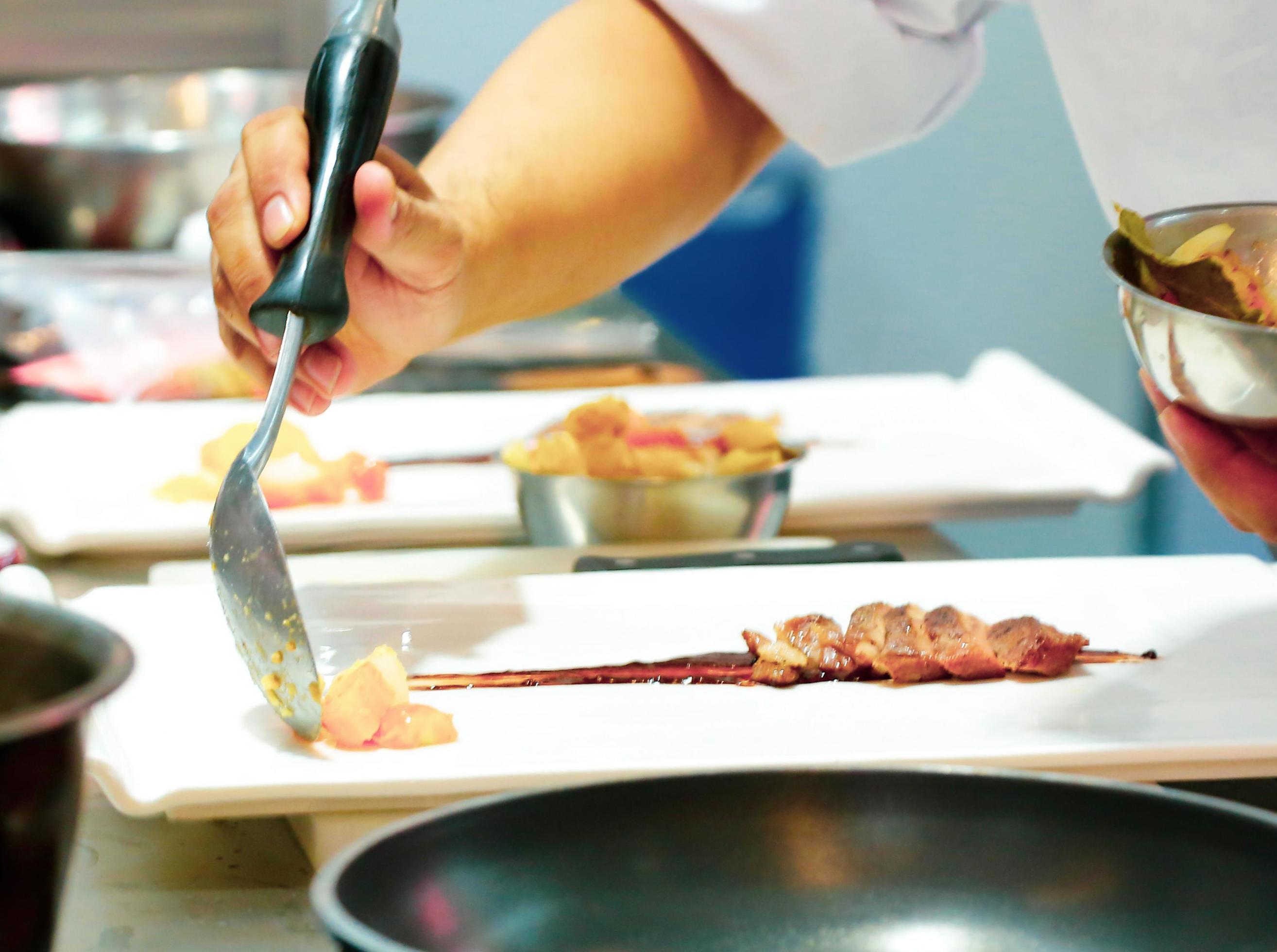 Chef preparing food in the kitchen, chef cooking, Chef decorating dish Stock Free