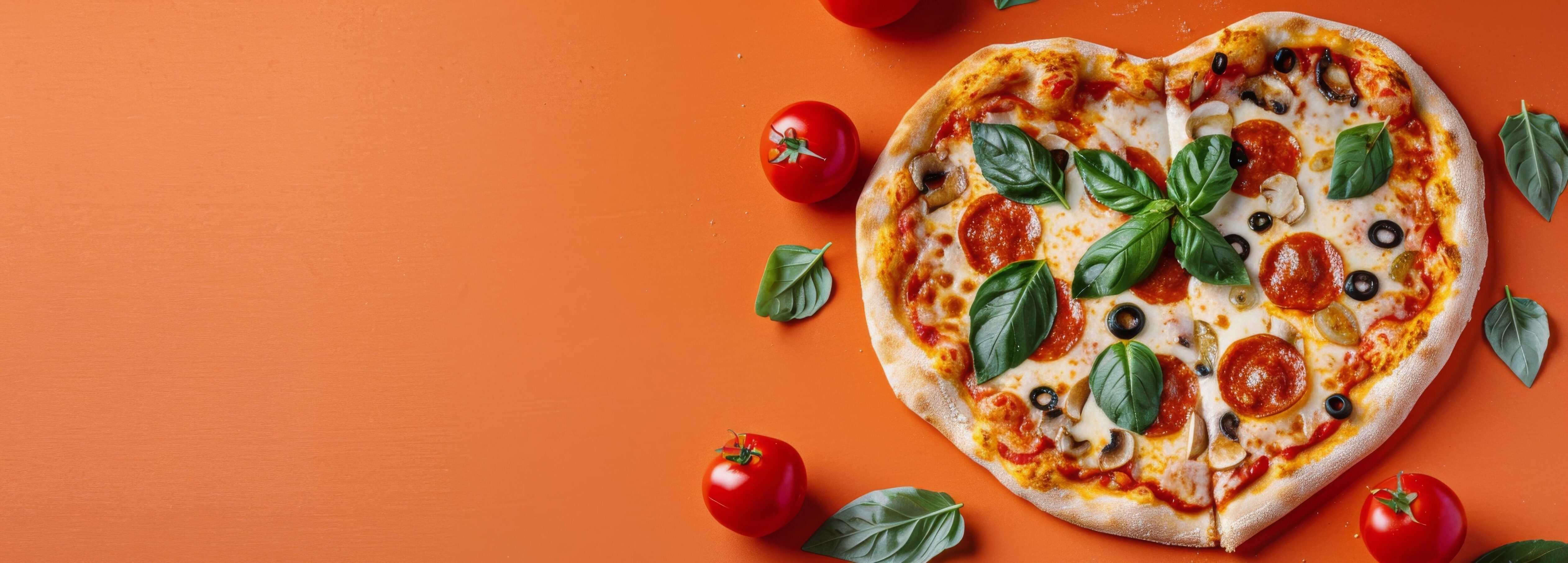 Heart-Shaped Pizza With Toppings Cut Into Slices On A Orange Background Stock Free