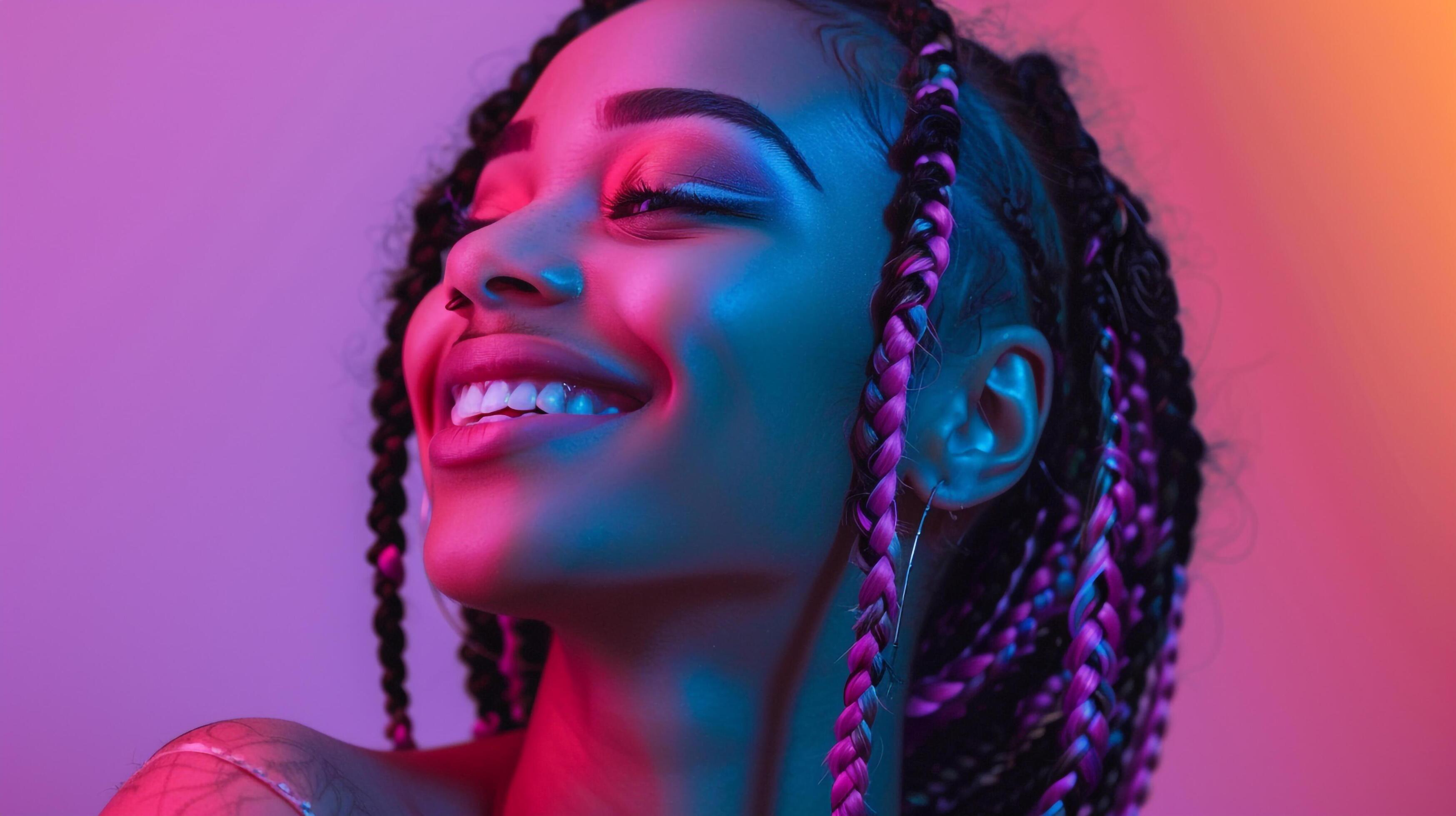 Smiling woman in pink top with braids Stock Free