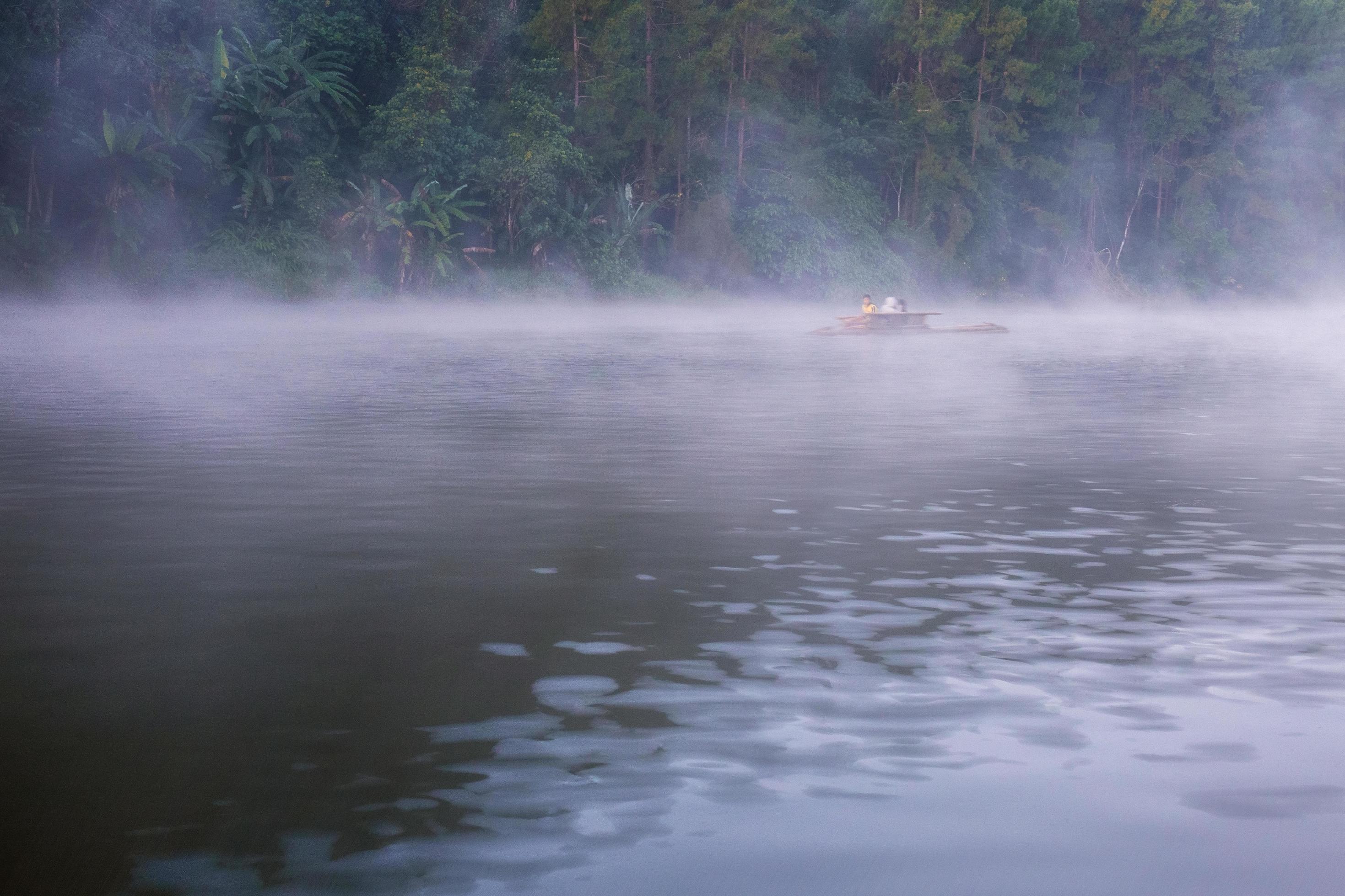 Water of lake with cold fog in winter. Stock Free