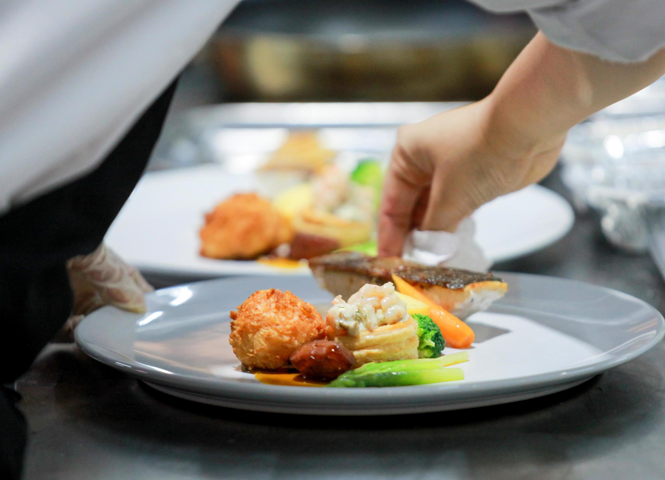 Chef preparing food in the kitchen, chef cooking, Chef decorating dish Stock Free