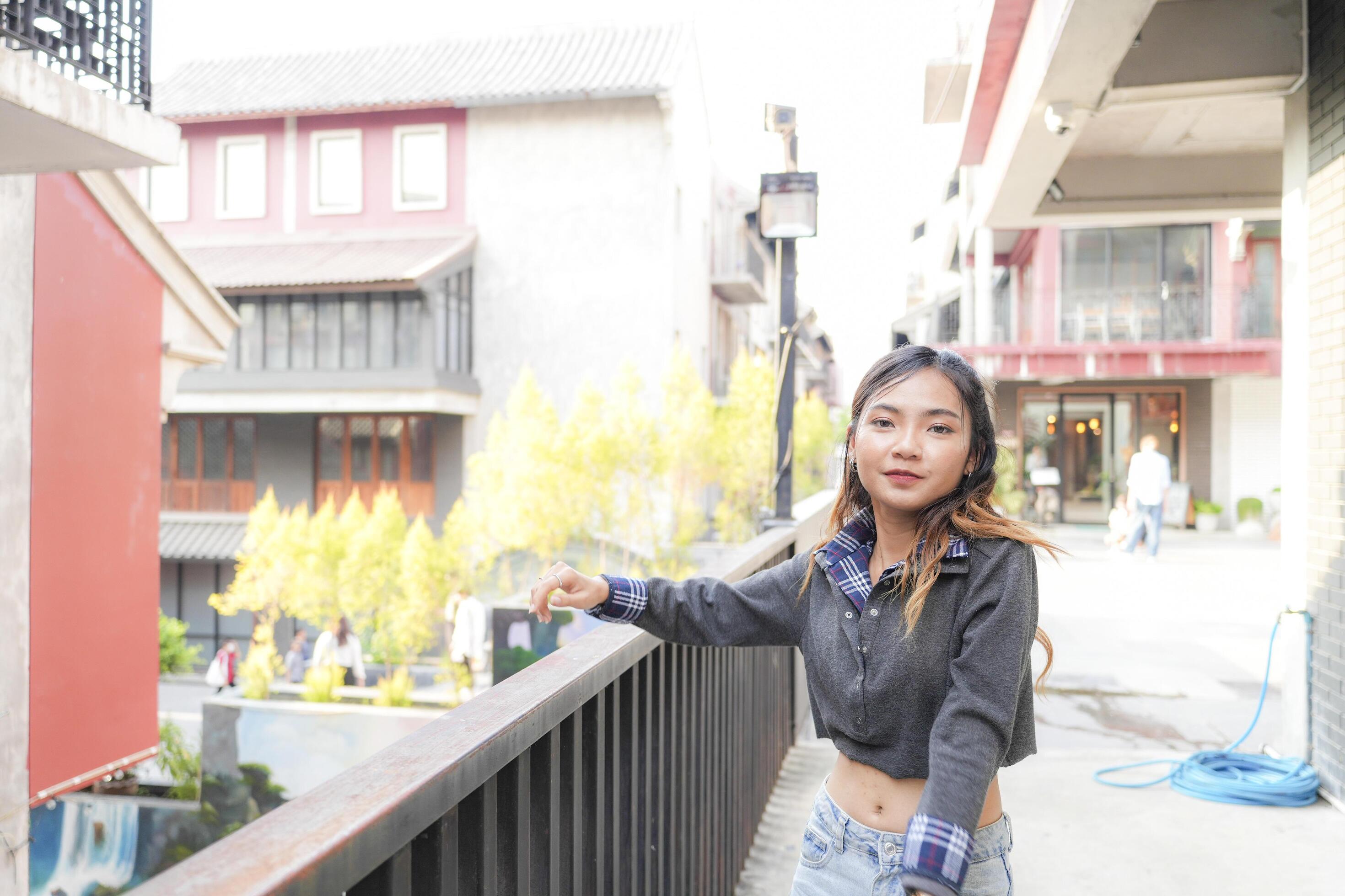 Asian women do freestyle hip hop and breakdancing in a public space in the middle of the city. With a cheerful and happy attitude Stock Free