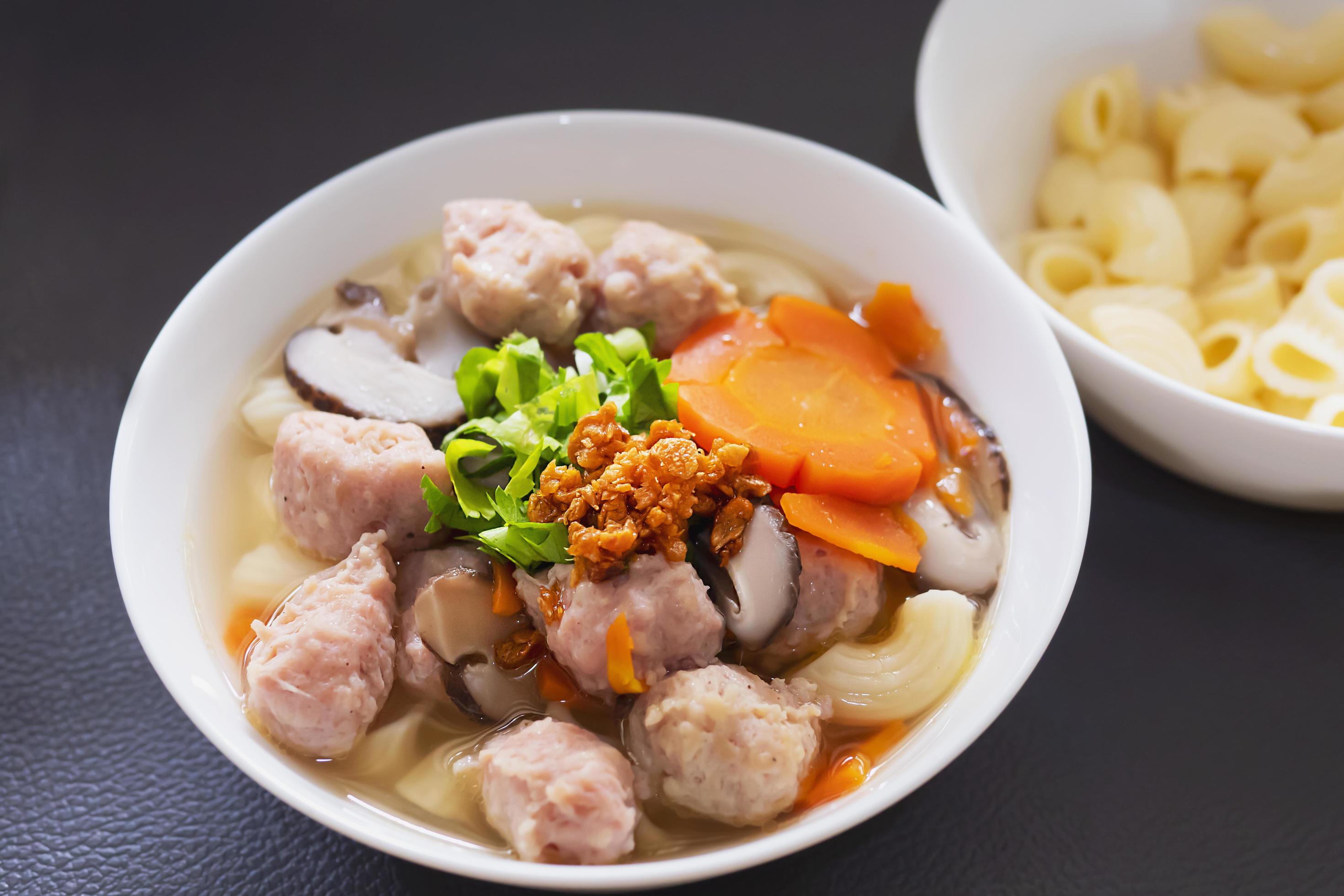 Macaroni soup with pork and carrot – delicious and healthy food concept Stock Free