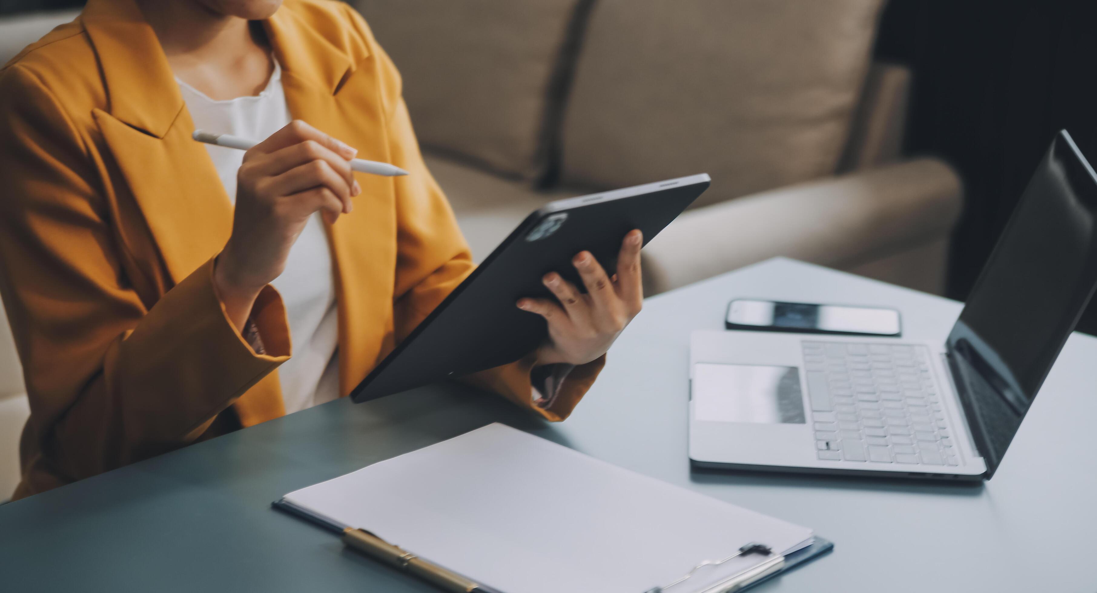 Portrait of a successful business woman using digital tablet Stock Free