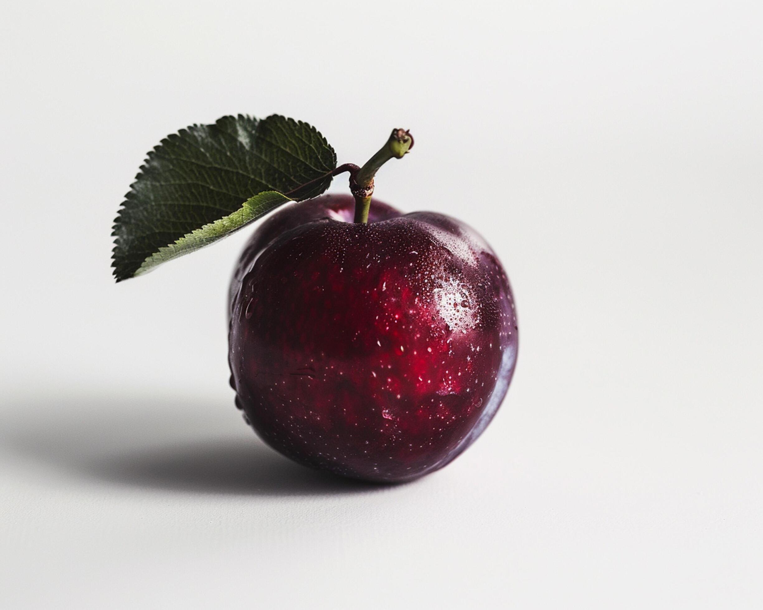 a single red apple with a leaf on it Stock Free