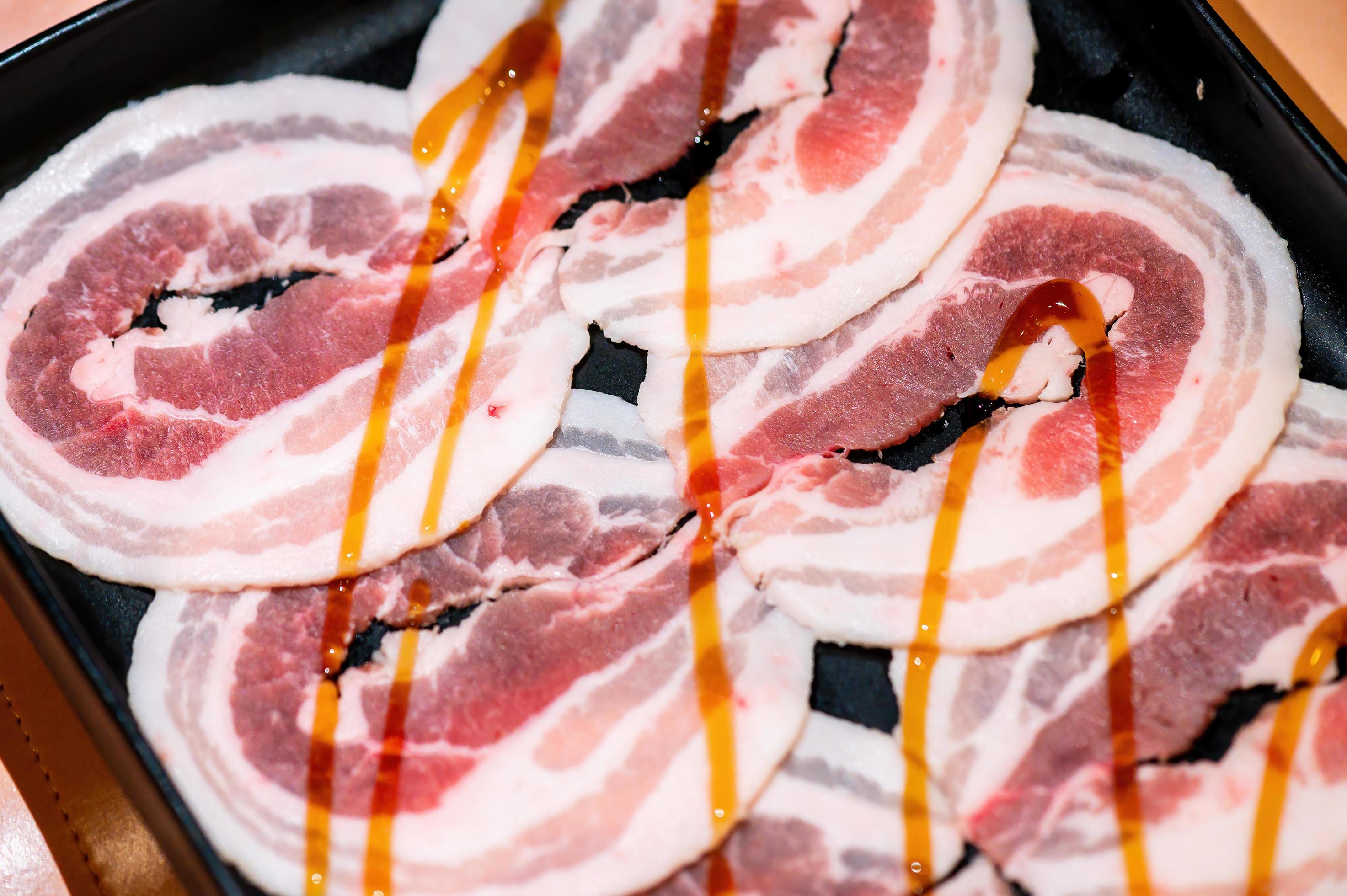 Slide raw beef for Yakiniku. Thin piece beef for Shabu hotpot japanese food style. Close up fresh meat chuck eye for Sukiyaki. top view Stock Free