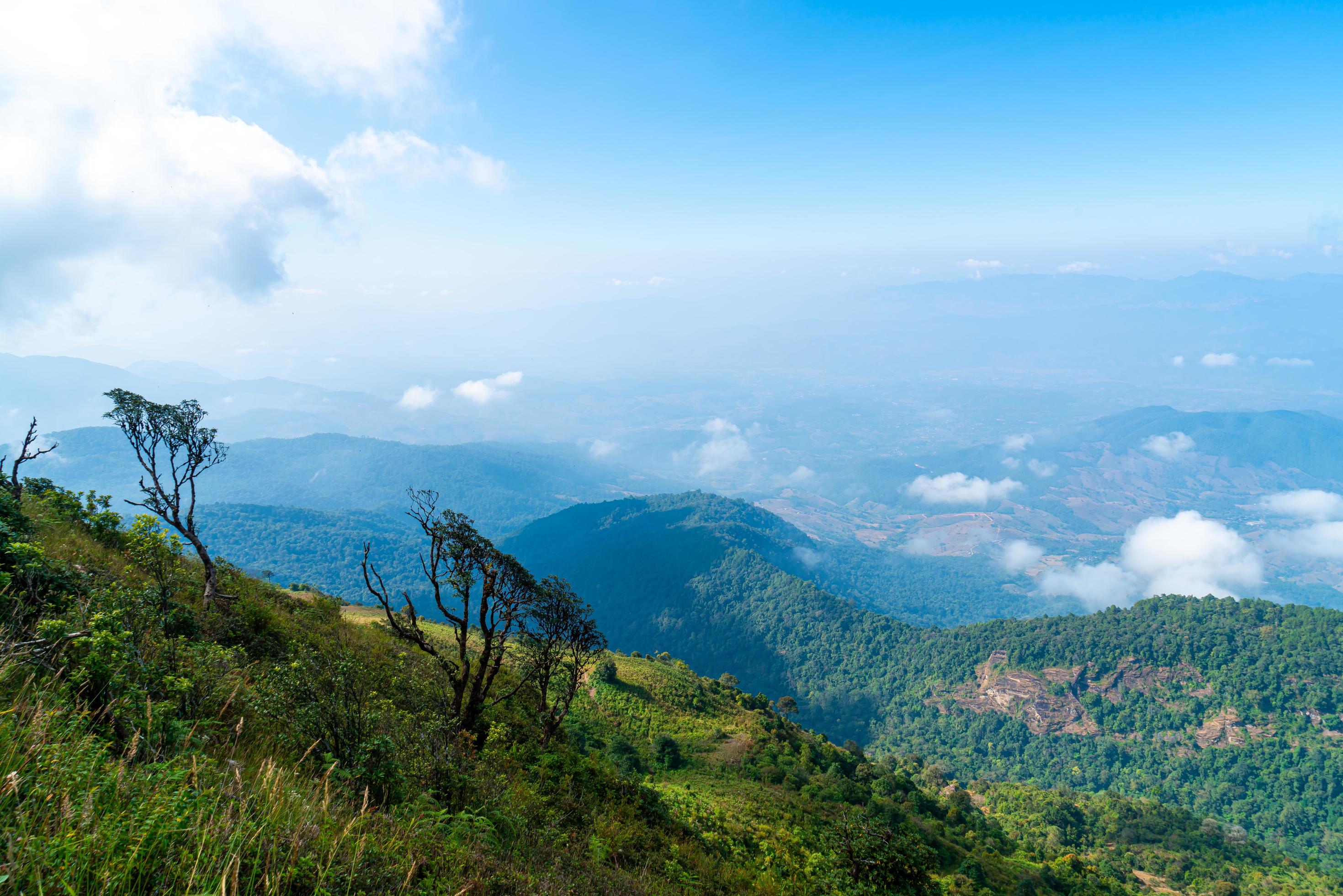 Beautiful mountain layer with clouds and blue sky at Kew Mae Pan Nature Trail in Chiang Mai, Thailand Stock Free