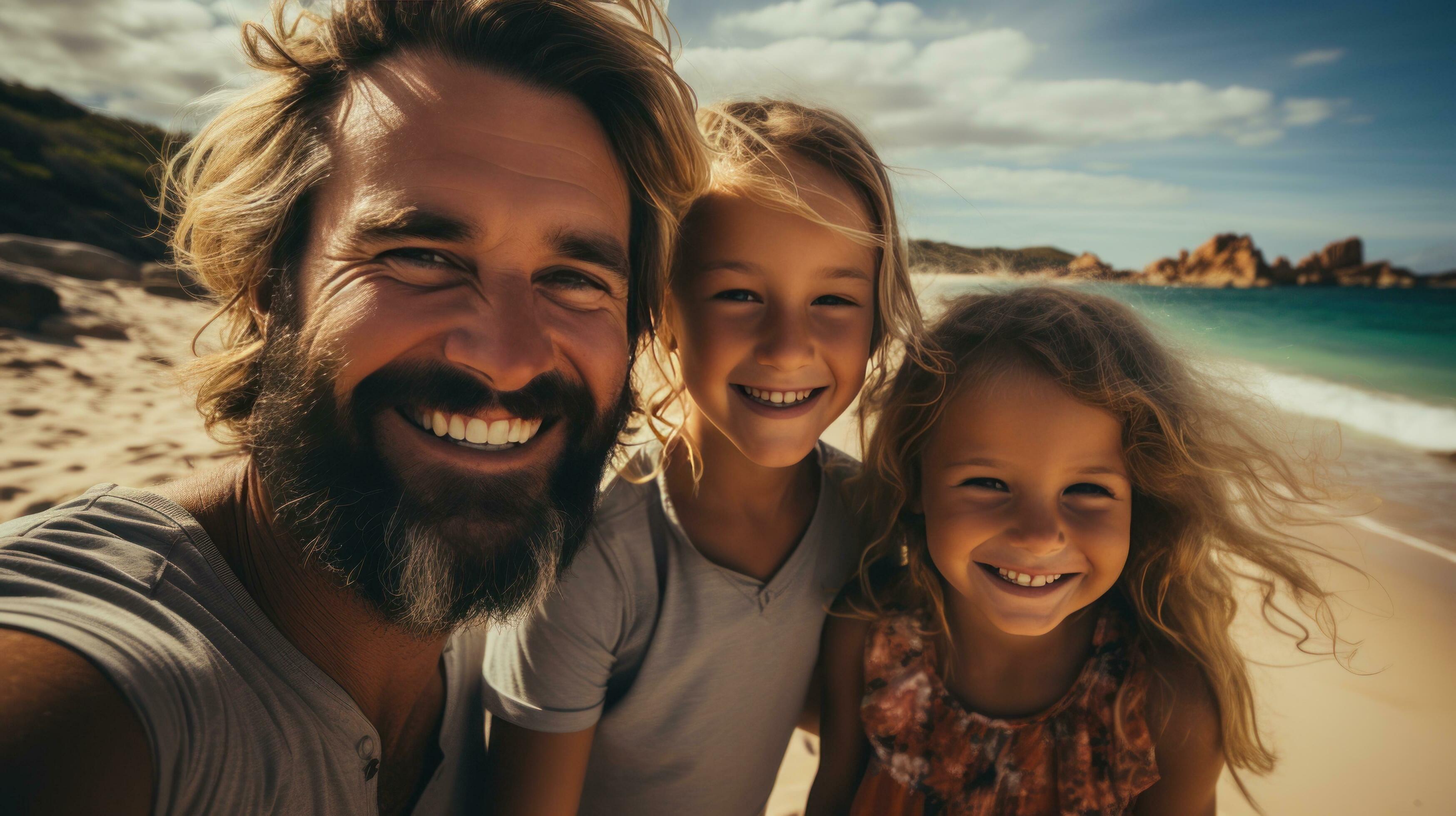 Excited family taking a group selfie on the shore Stock Free