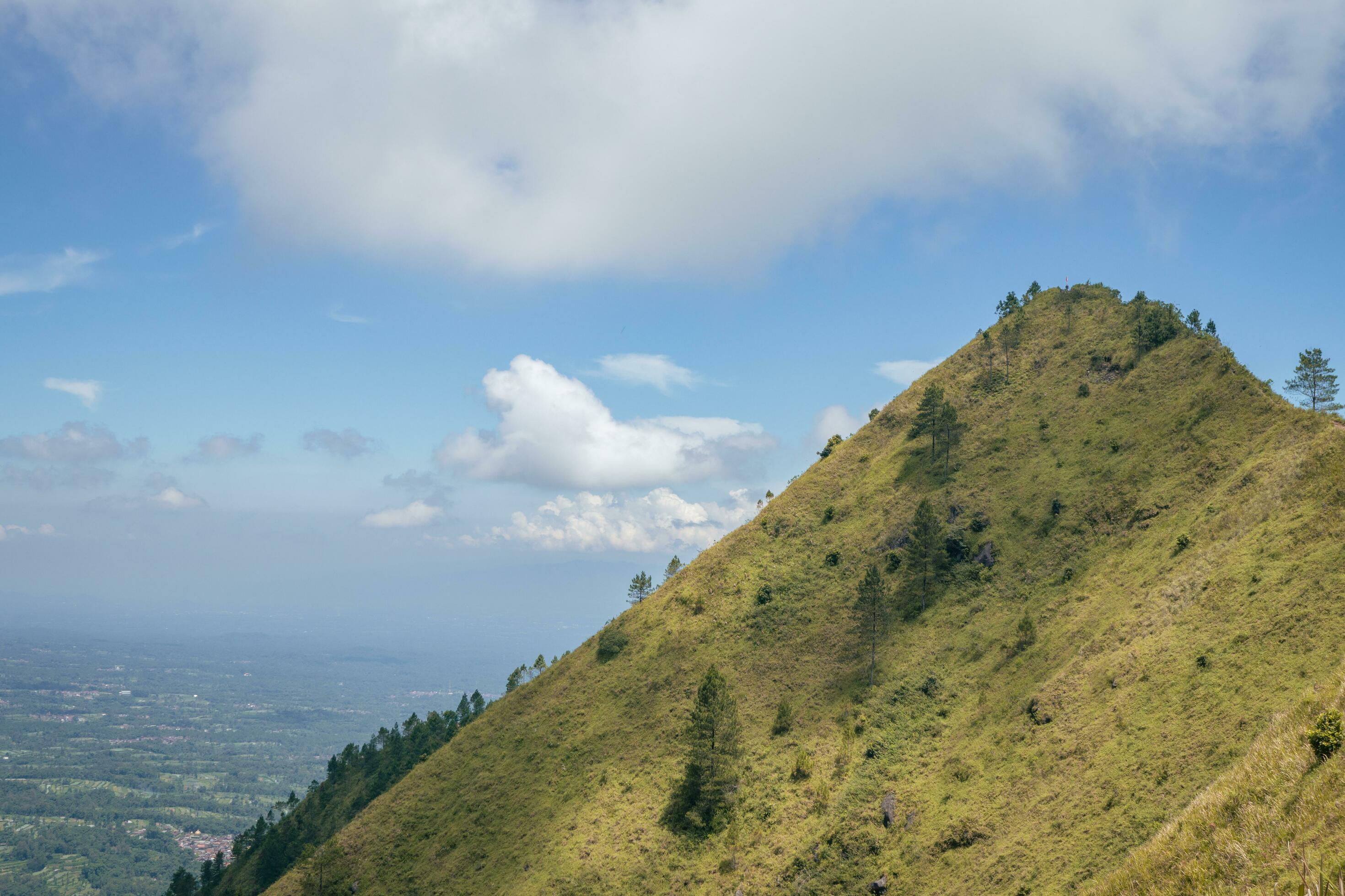 Landscape mountain when morning time sunlight summer vibes. The photo is suitable to use for adventure content media, nature poster and forest background. Stock Free