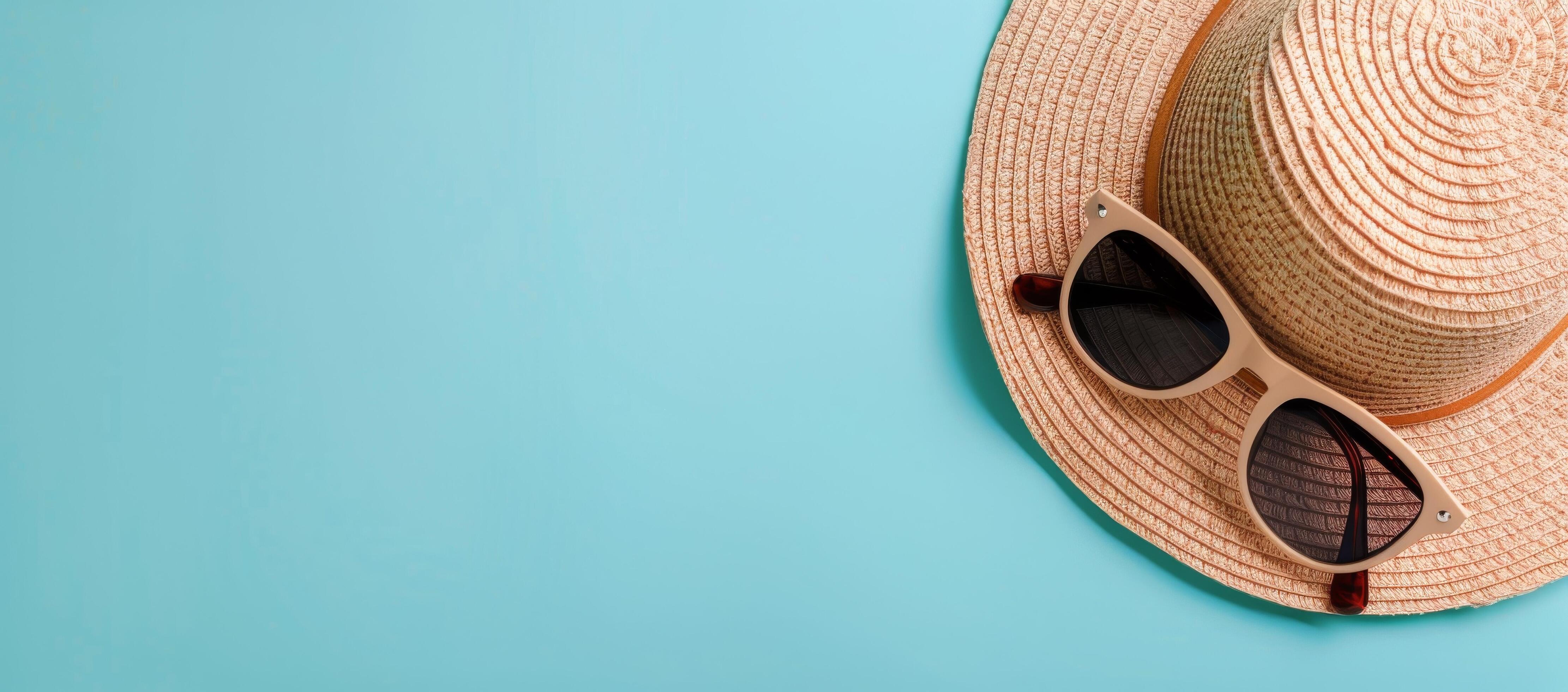 Summer Hat and Sunglasses on Light Blue Background Stock Free