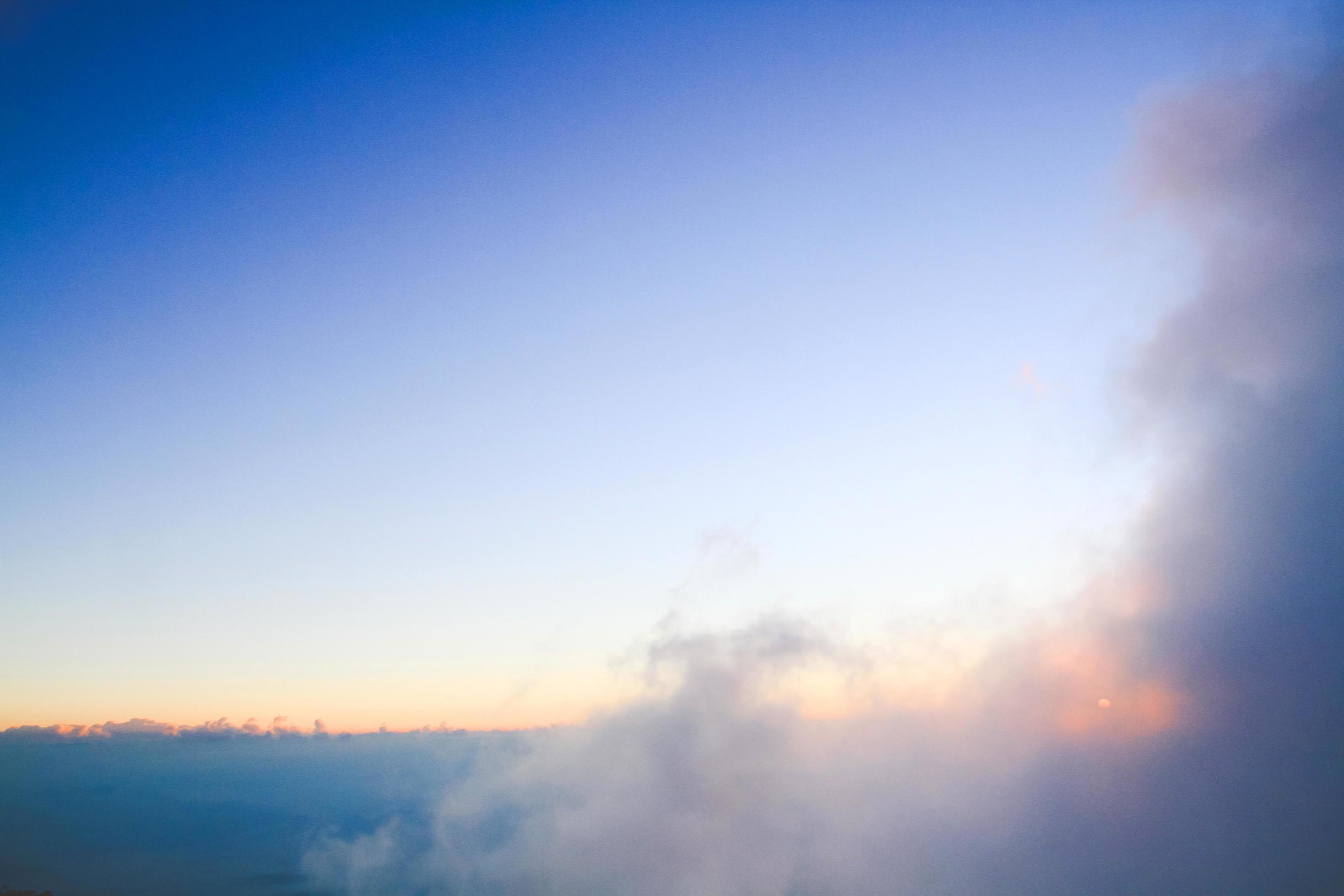 Sunset in sky and cloud, beautiful colorful twilight time with silhouette of mountain. Stock Free