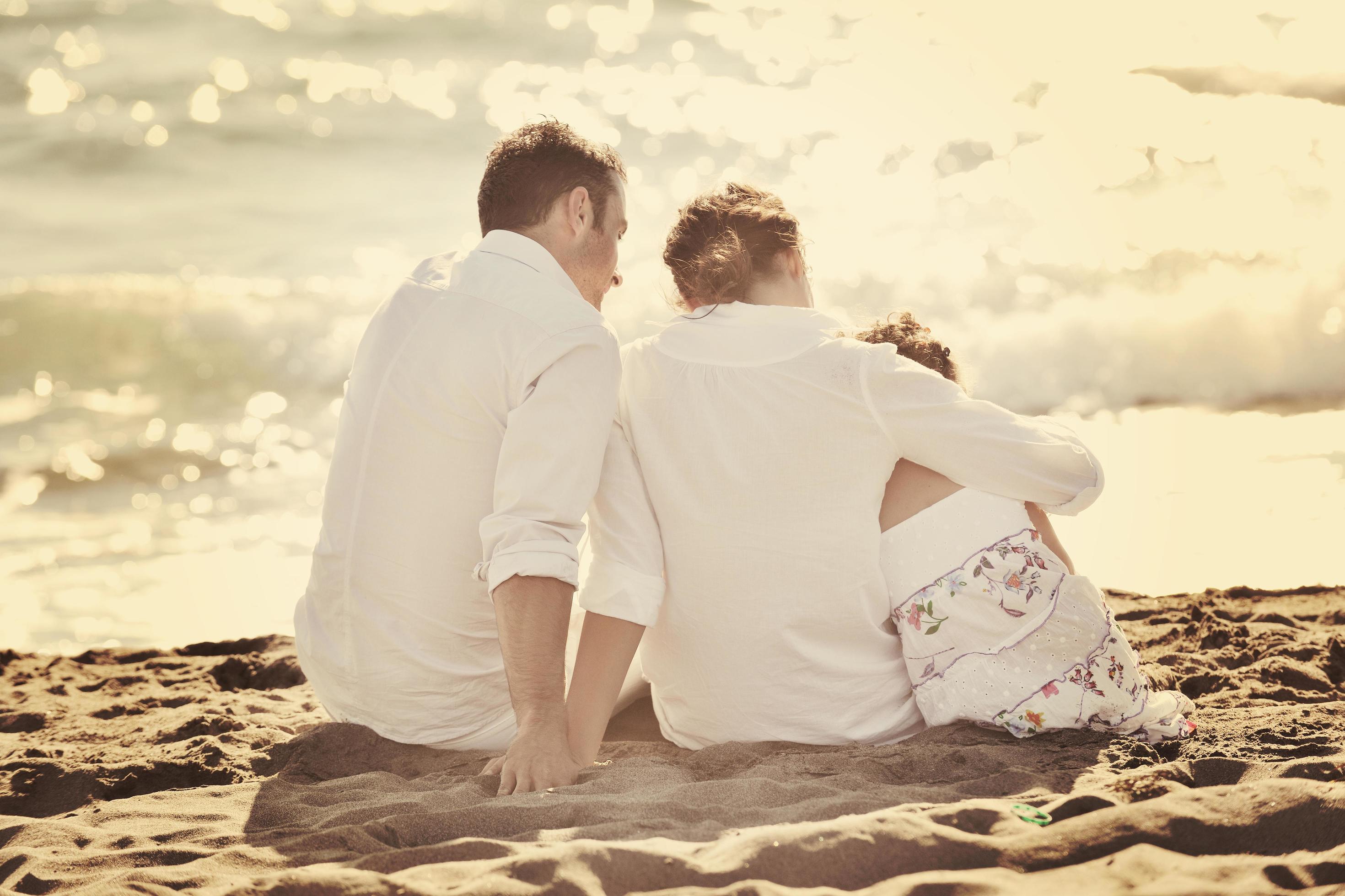 happy young family have fun on beach Stock Free