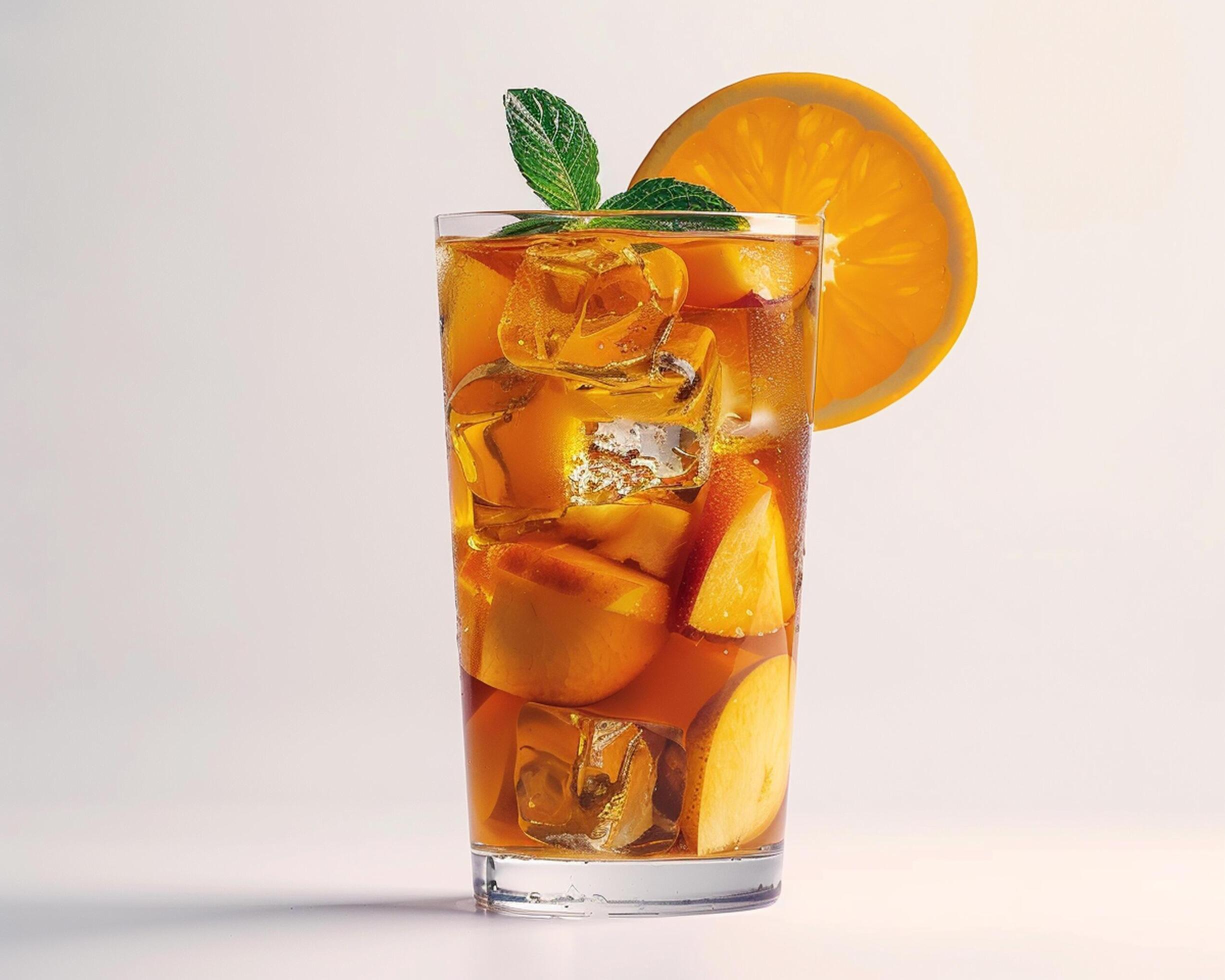 an orange and mint tea with ice cubes Stock Free