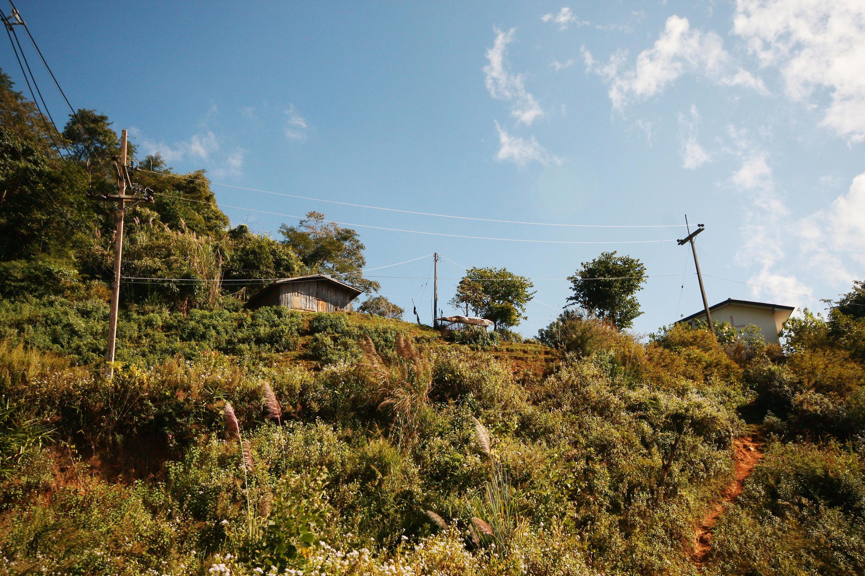 The electric cables is located on the mountain and forest at countryside in Thailand Stock Free