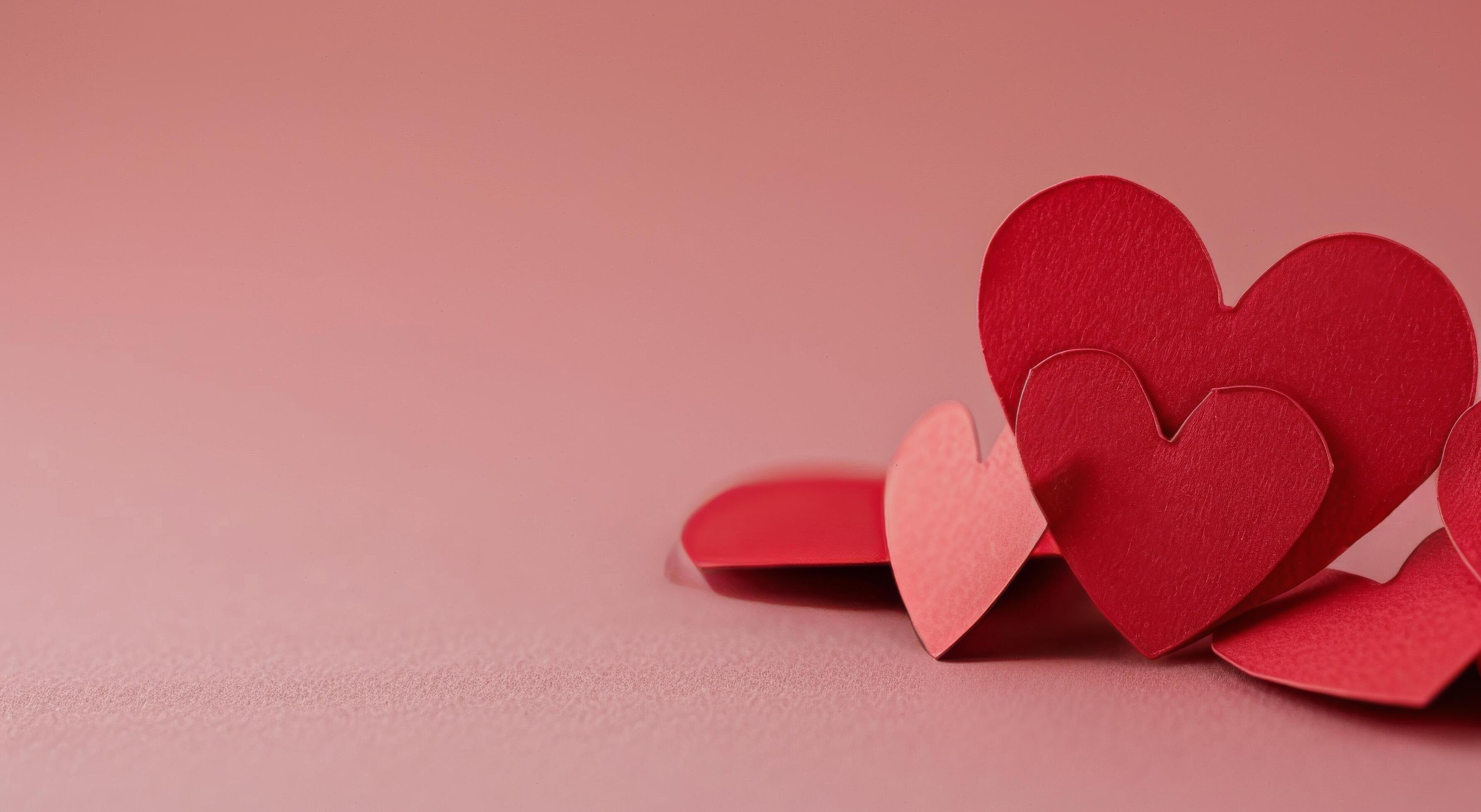 Red Paper Hearts on a Pink Background for Valentine’s Day Celebration Stock Free