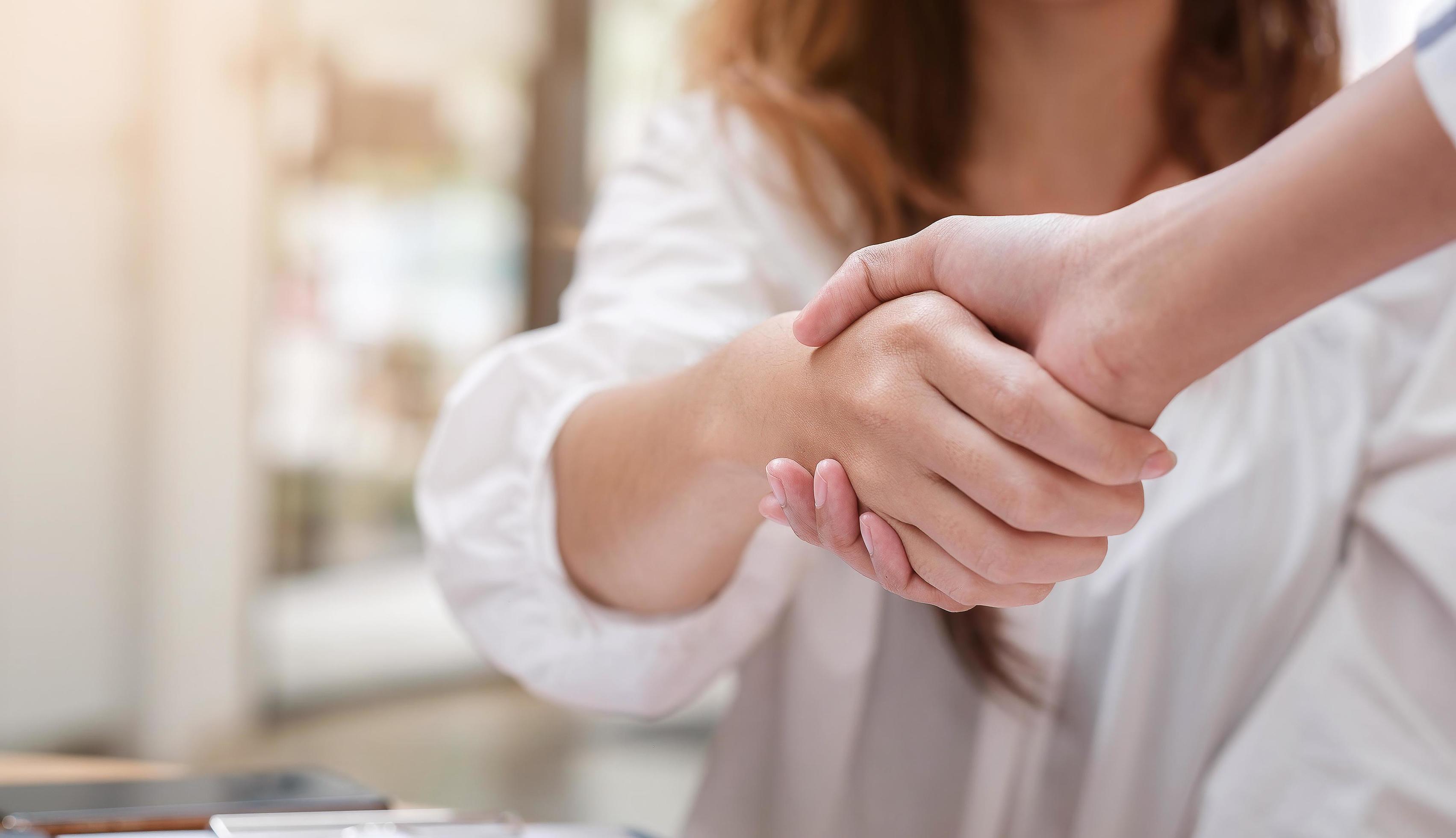 Close up of Business people shaking hands, finishing up meeting Stock Free