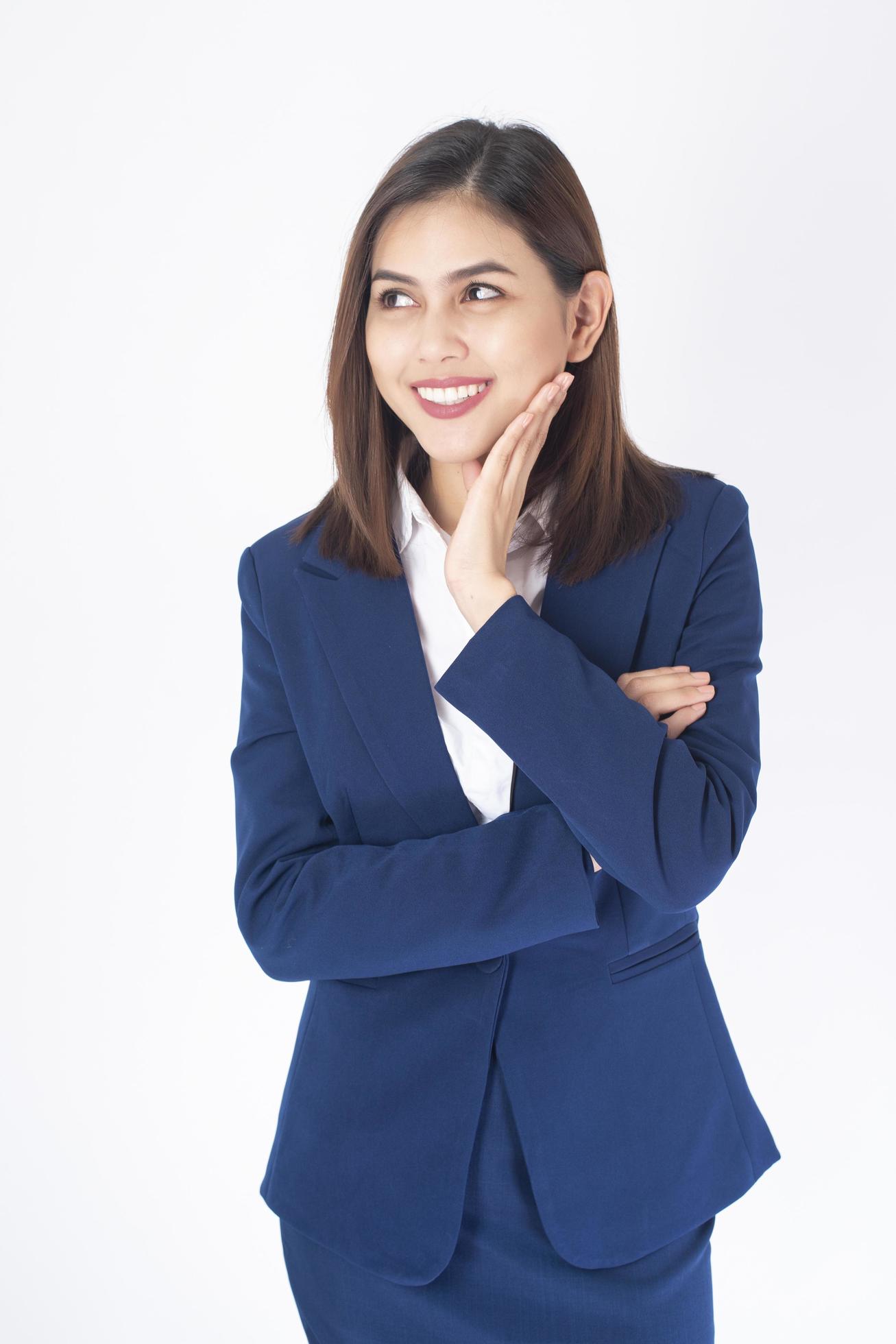 Woman in blue suit is smiling on white background Stock Free