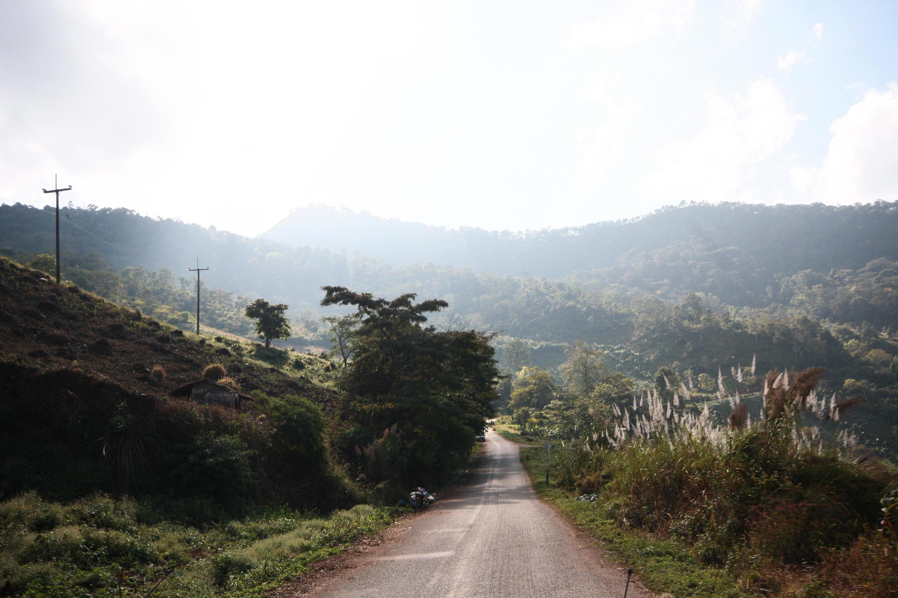 Life of hill tribe farmers and car parking beside country road on the mountain in Thailand Stock Free