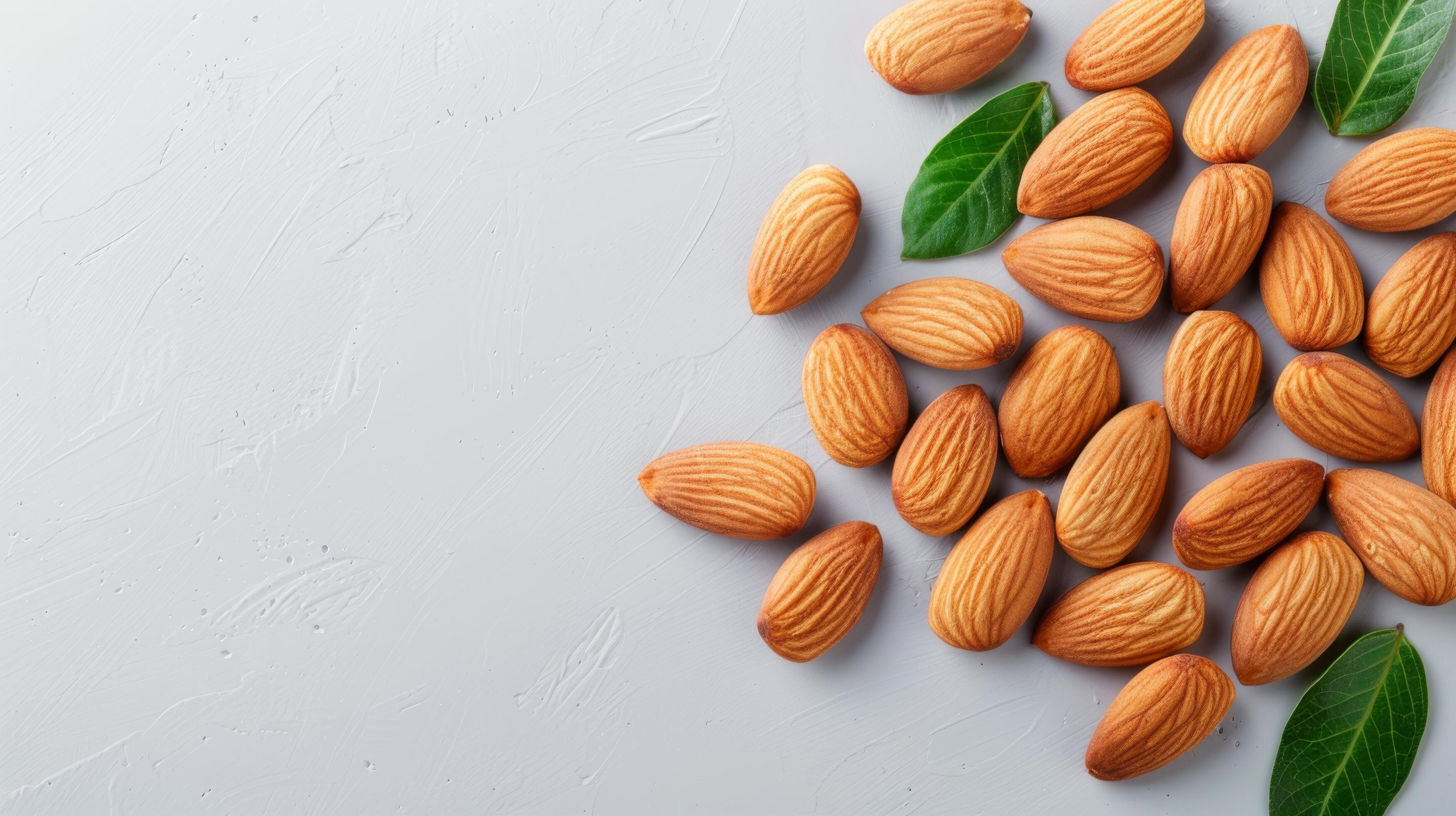 Fresh Almonds With Green Leaves on a Light Background Stock Free